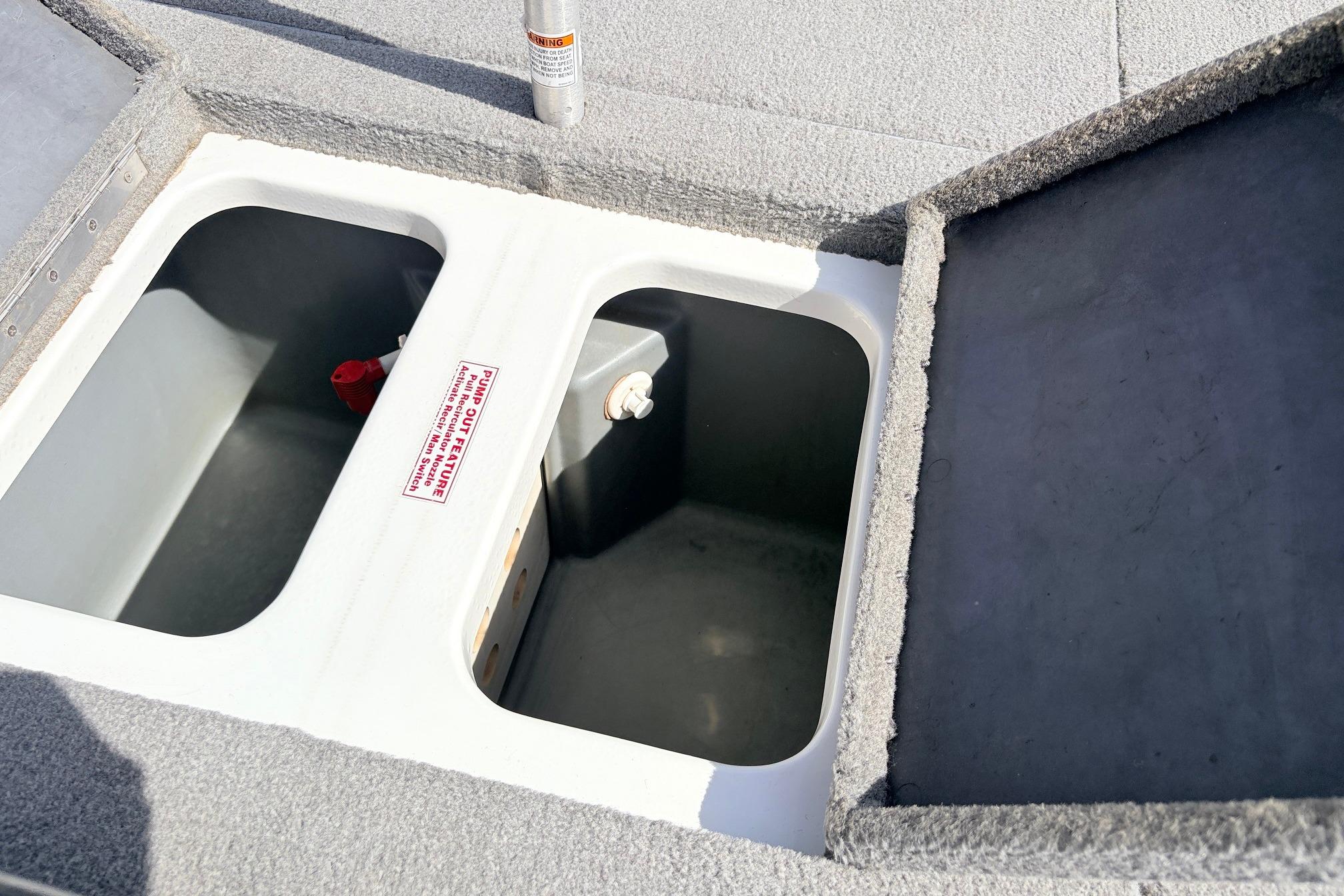 Open storage compartments on a 2011 Nitro Z-7 boat deck.