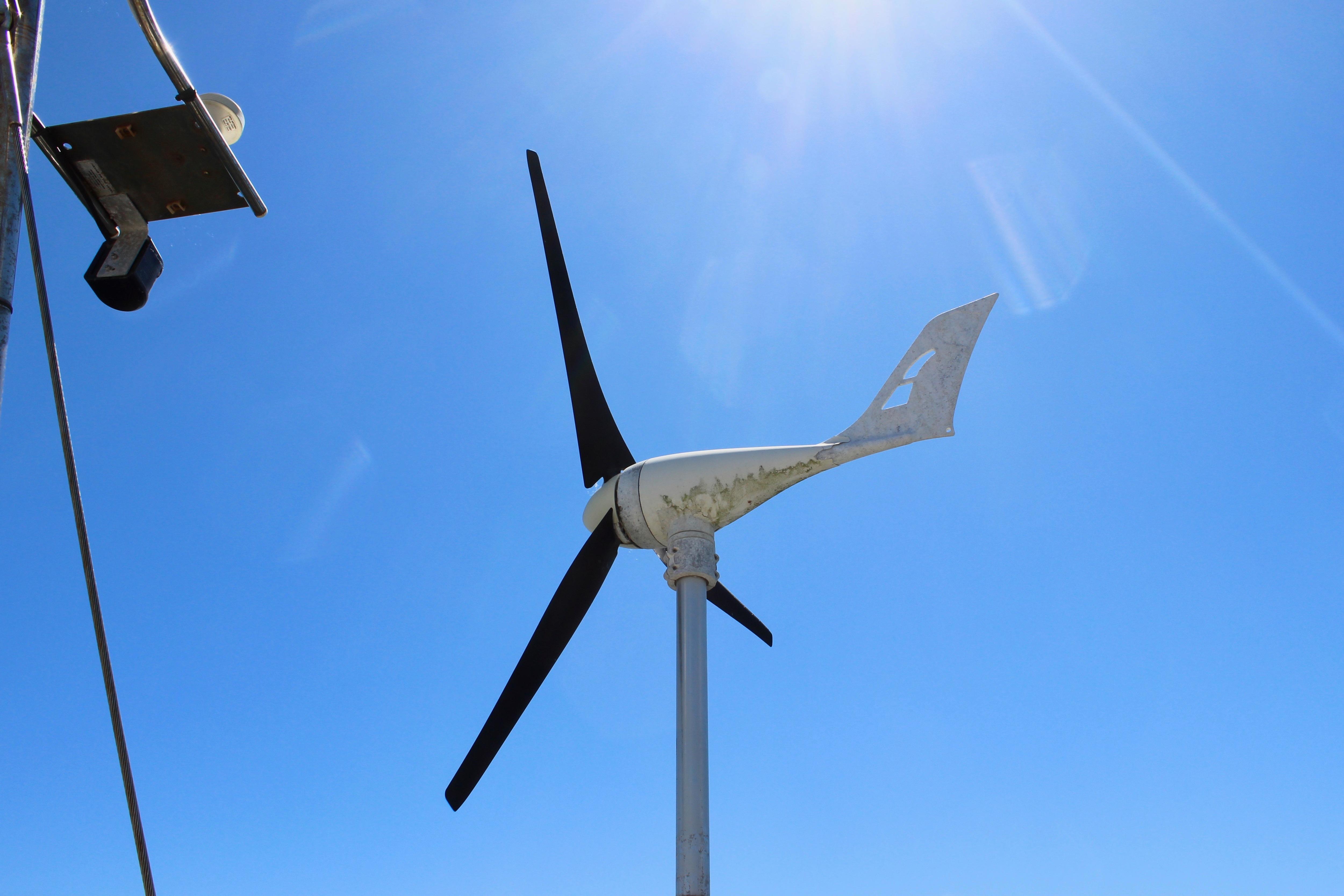 Wind turbine against clear blue sky on a Kelly Peterson 46 sailboat, 1981 model.