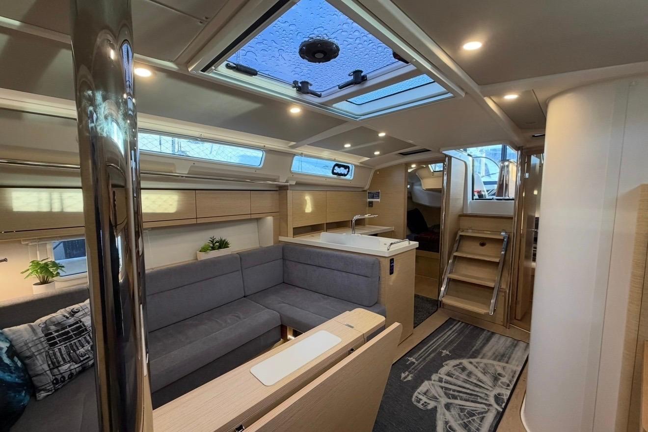Modern interior of 2022 Hanse 418 yacht with sleek design and comfortable seating.