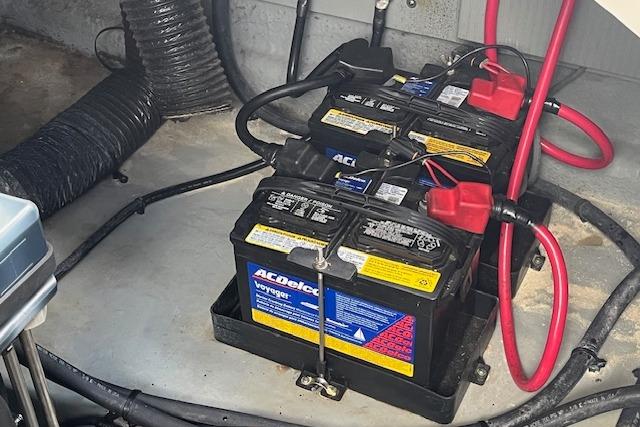 Batteries in a 2003 Sea Ray 260 Sundancer boat engine compartment.