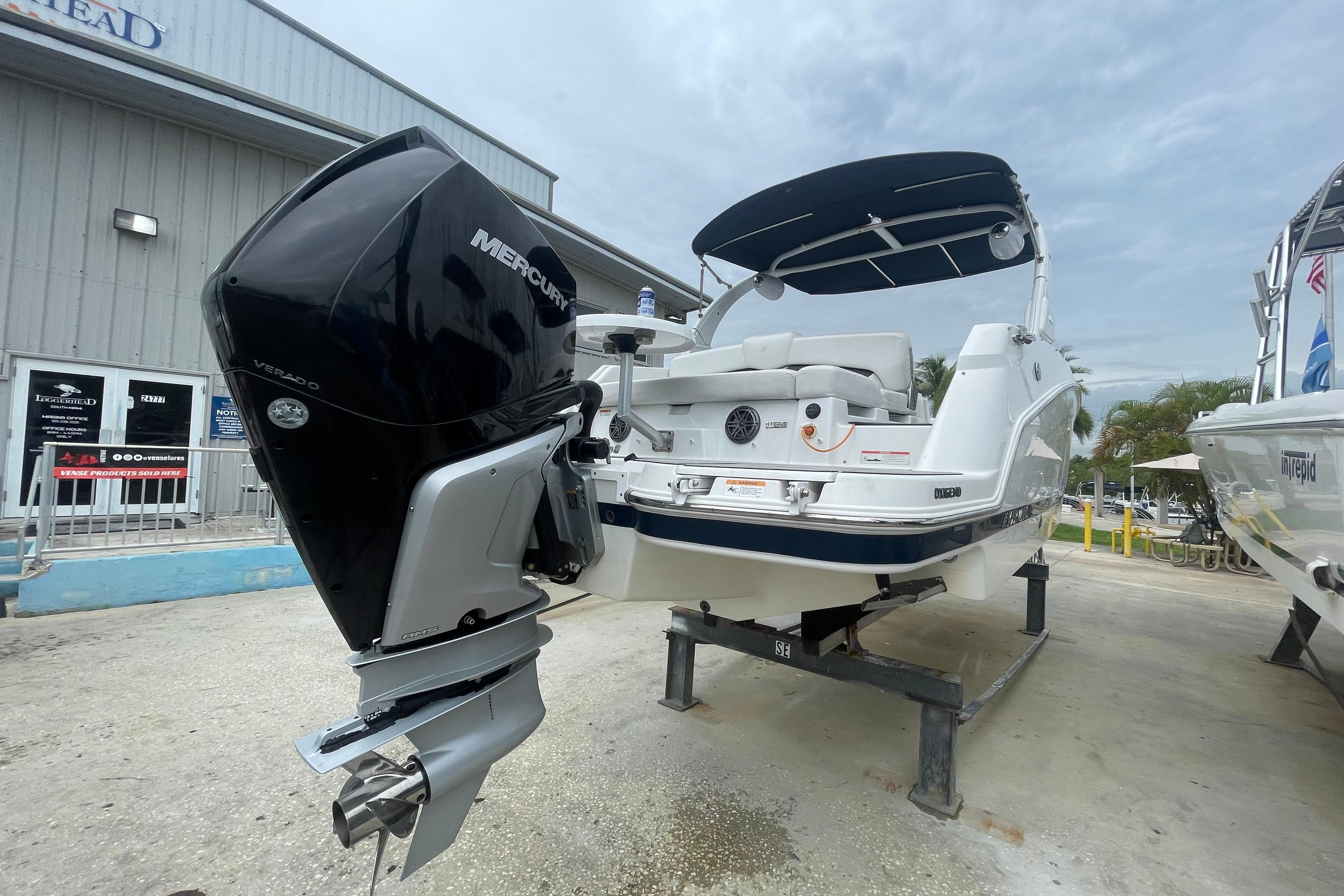 2022 Four Winns HD8 OB boat with Mercury Verado outboard engine, displayed outdoors.