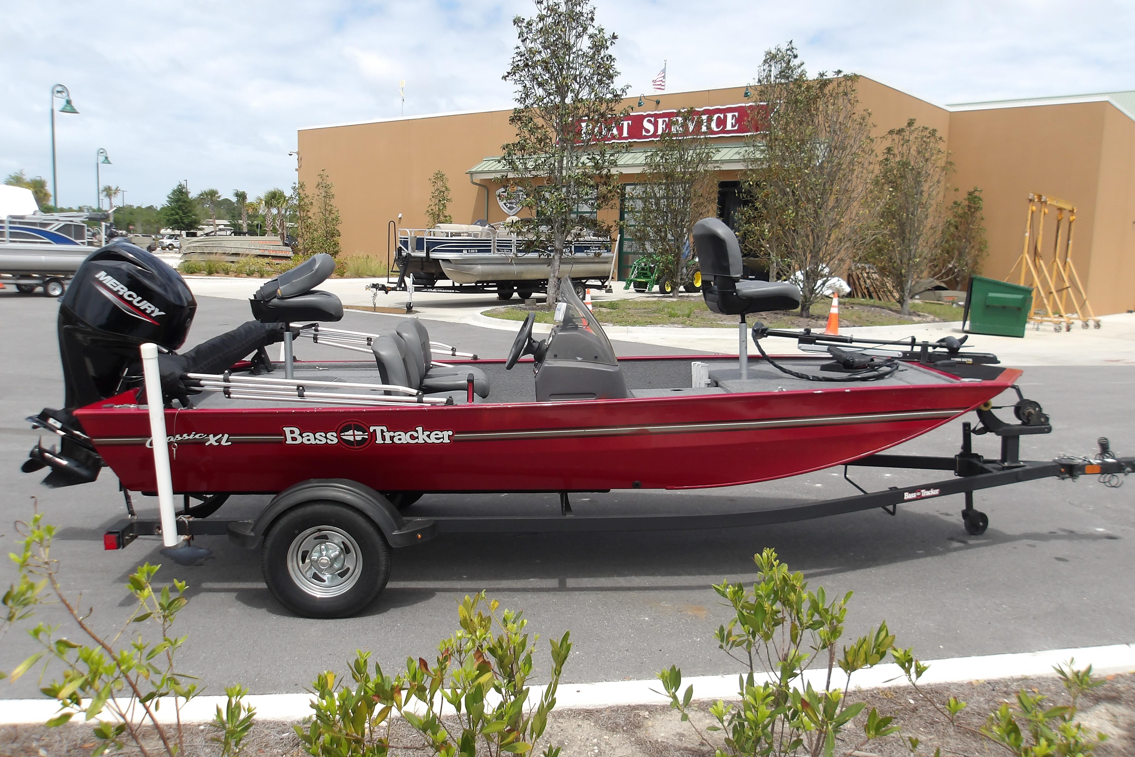 2024 Tracker Bass Tracker Classic XL boat on trailer outside service center.