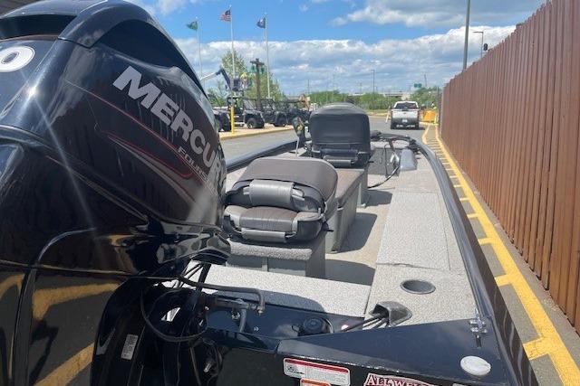 2019 Tracker Panfish 16 boat with Mercury engine, parked outdoors on a sunny day.