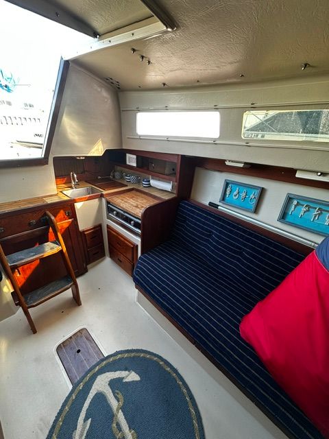 Interior of a 1985 Catalina 27 with a galley and seating area.