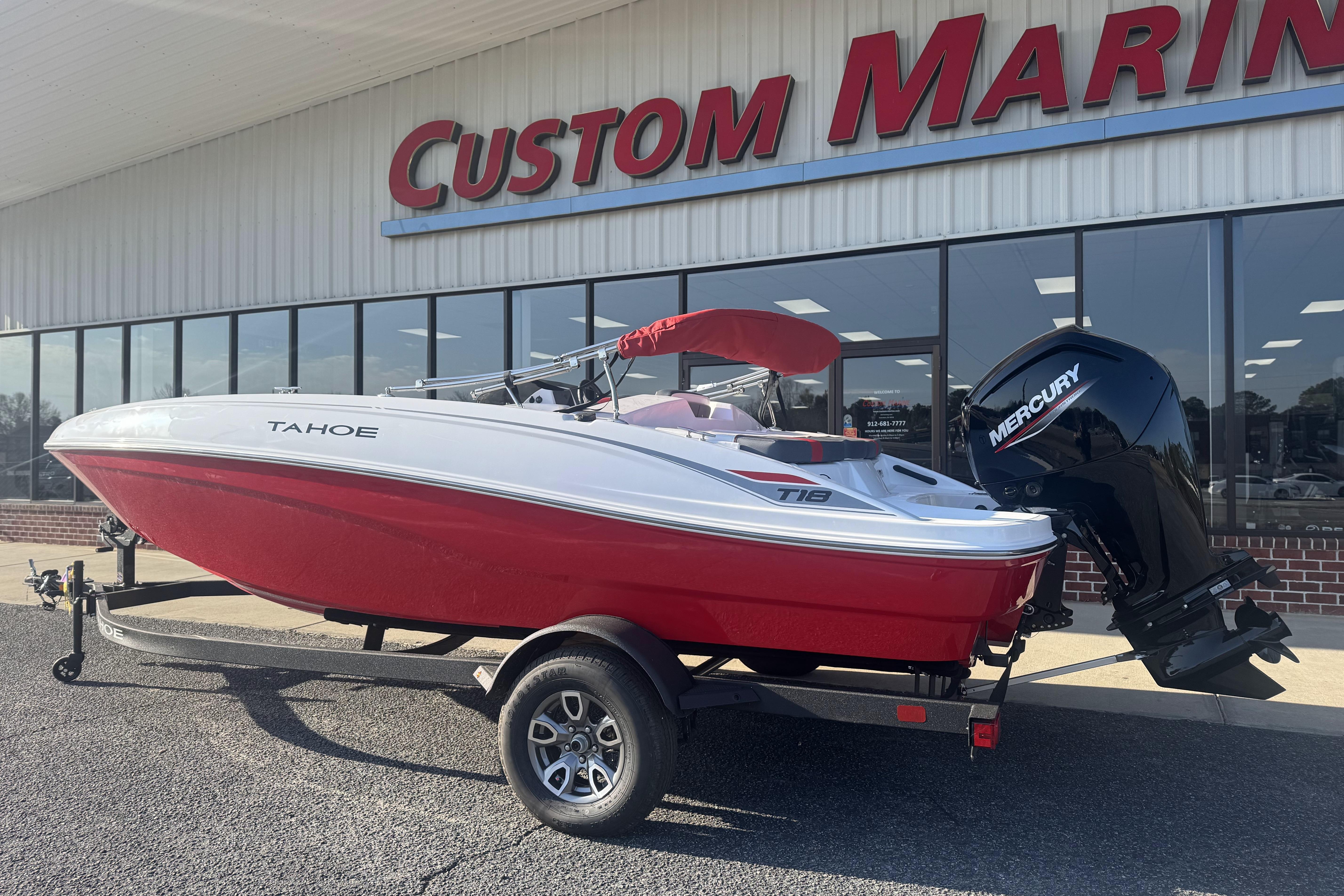 2026 Tahoe T18 boat with Mercury engine at Custom Marine dealership.