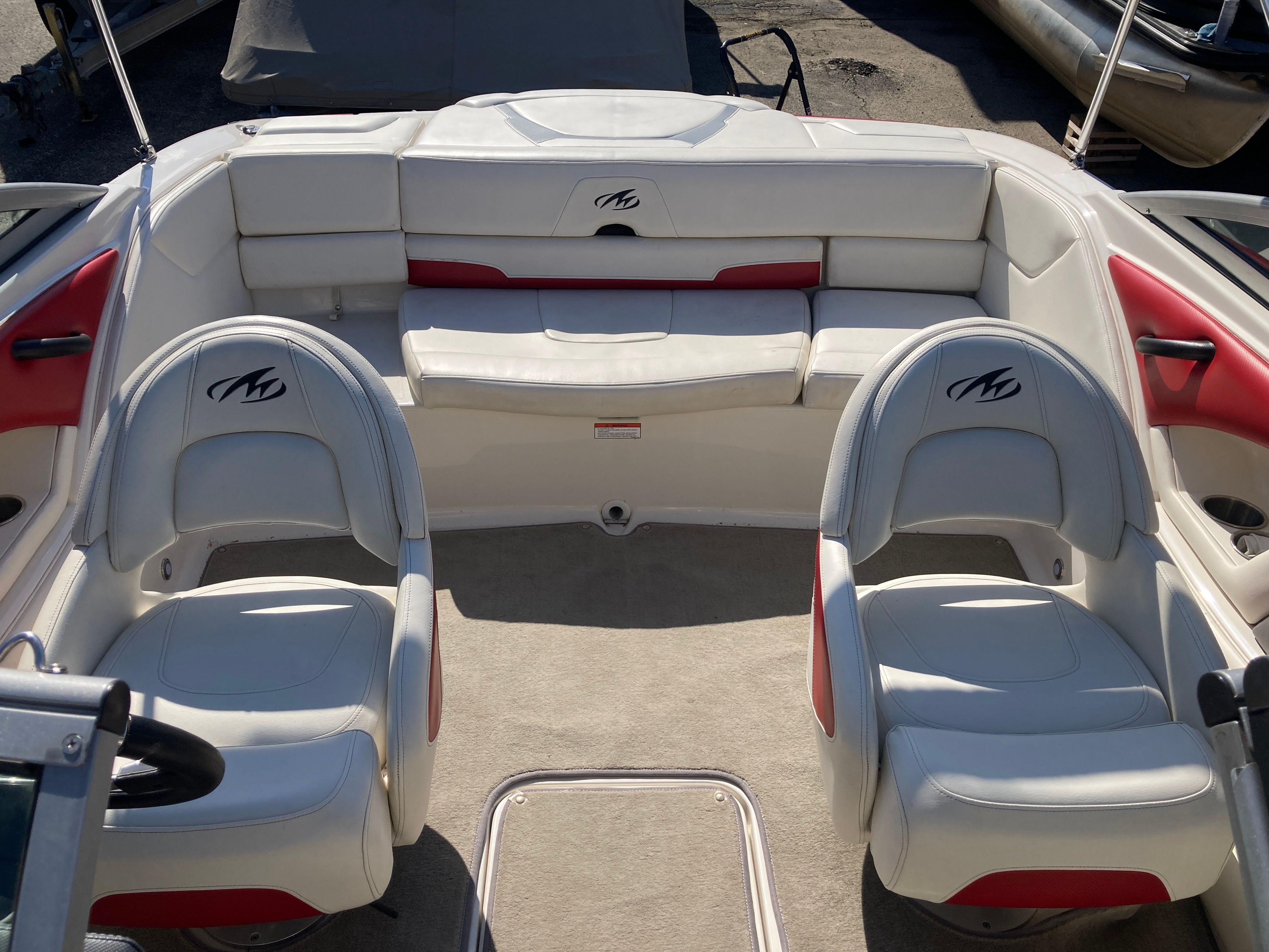 Interior of a 2012 Monterey 204FS boat with white seating.