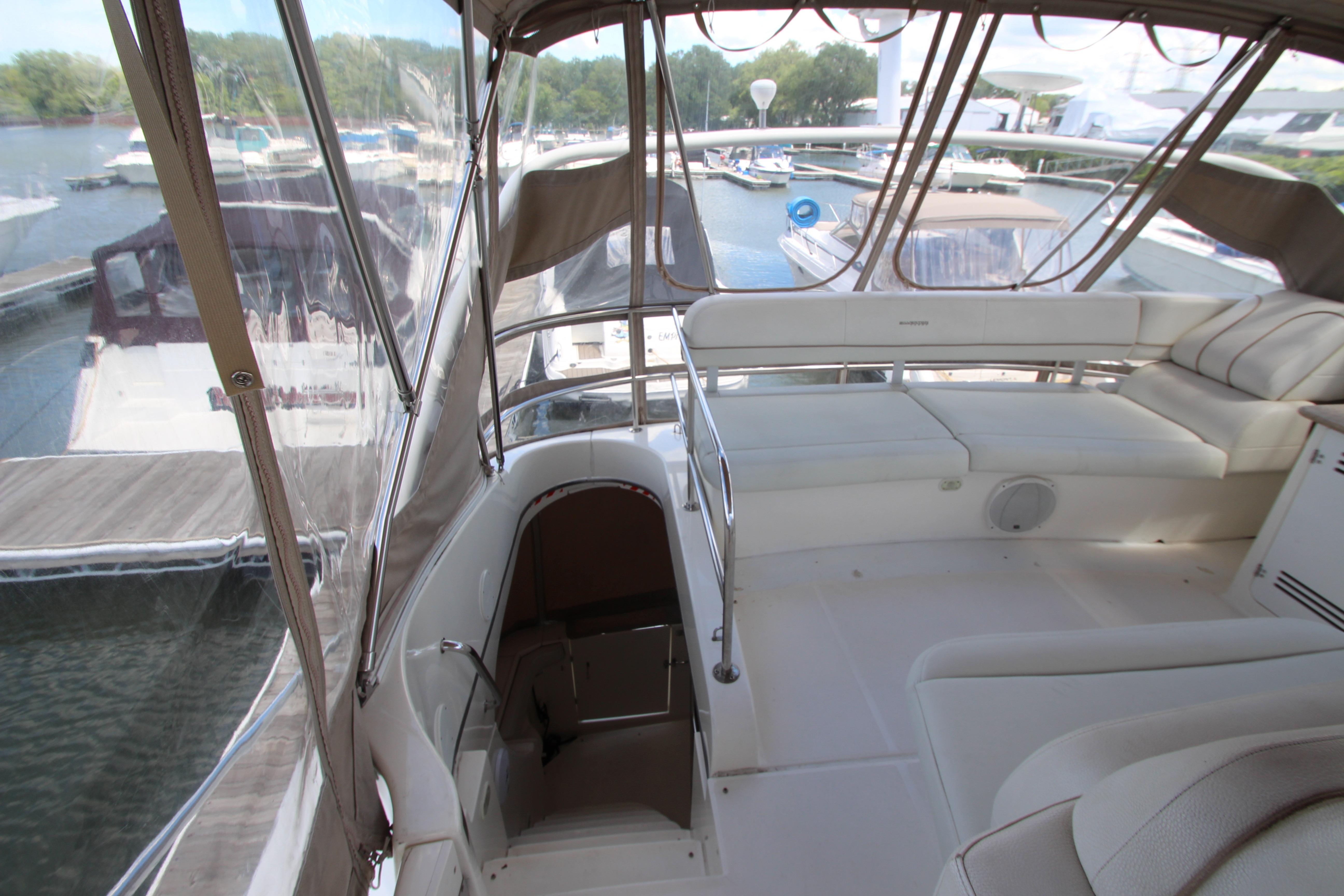 2006 Silverton 38 Sport Bridge interior with spacious seating and marina view.