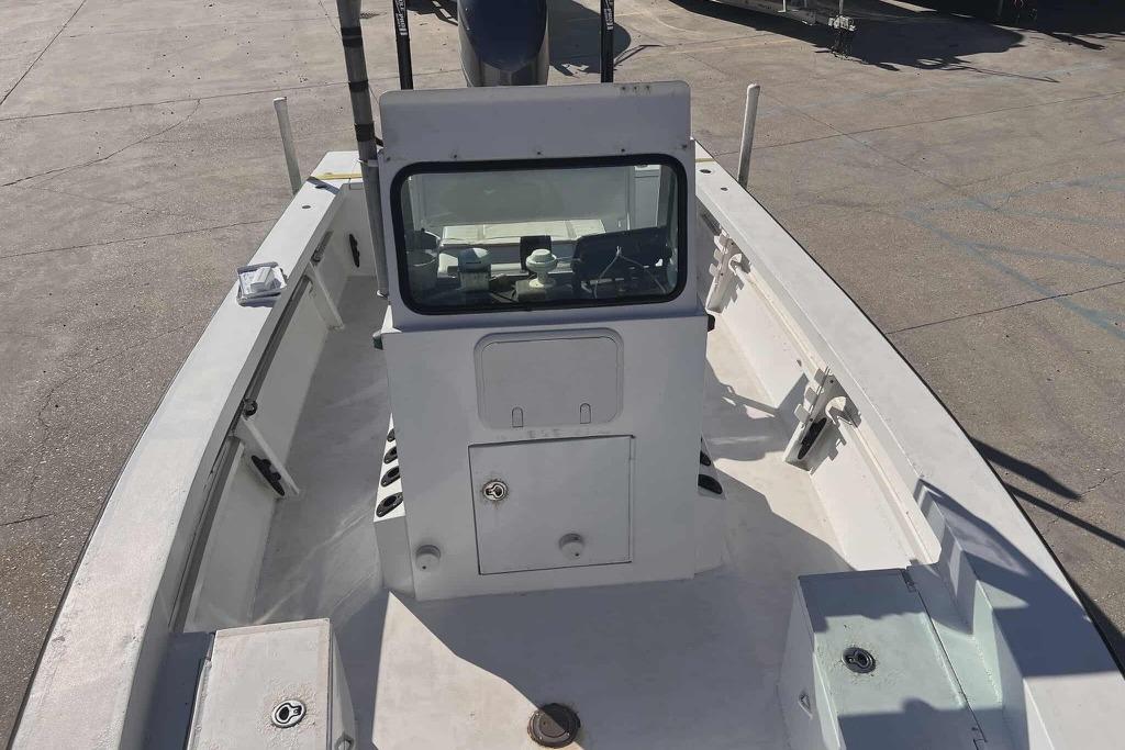 1997 Gravois 20CC boat interior with console and seating, docked on concrete surface.