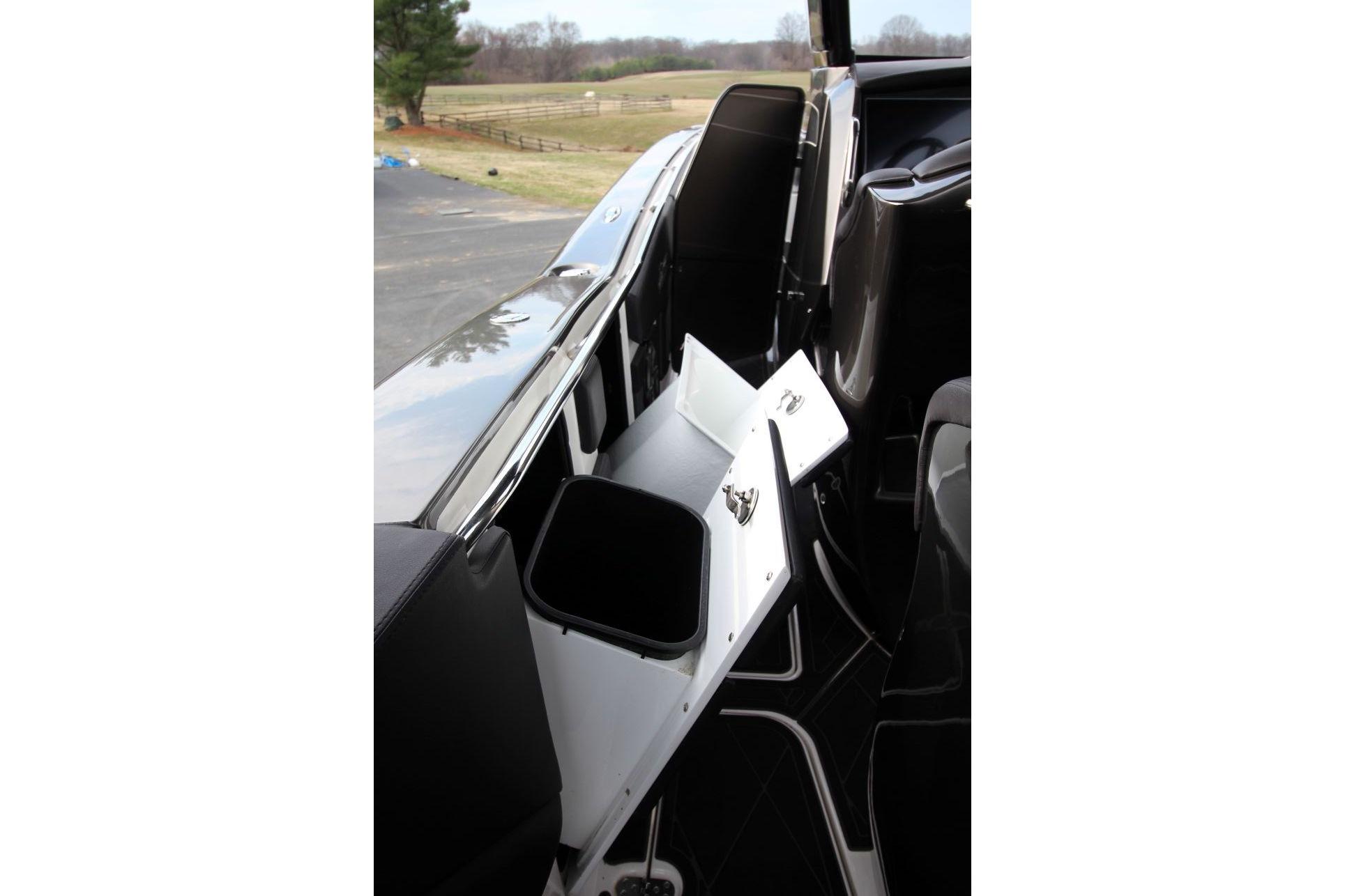 Interior view of 2018 MTI V42 boat with open storage compartment.