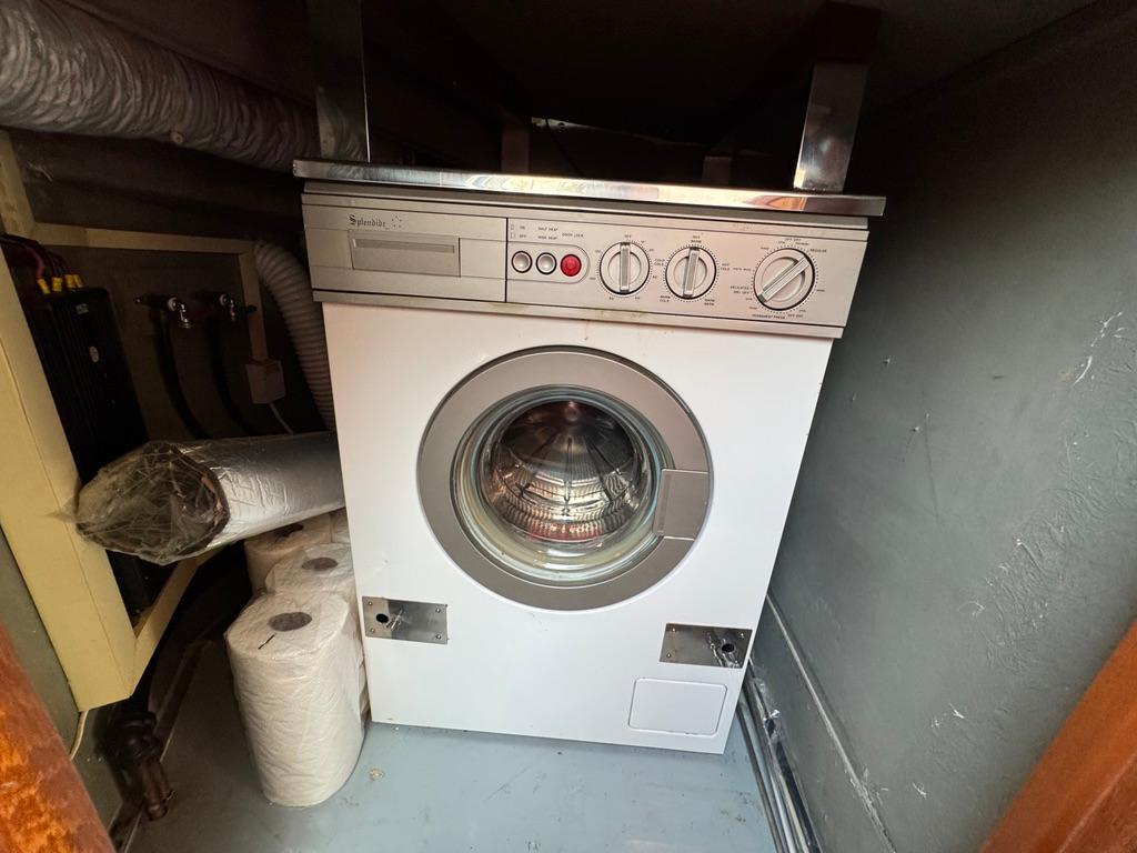 Washing machine in 1989 Birchwood 62 Cockpit Motor Yacht laundry area.