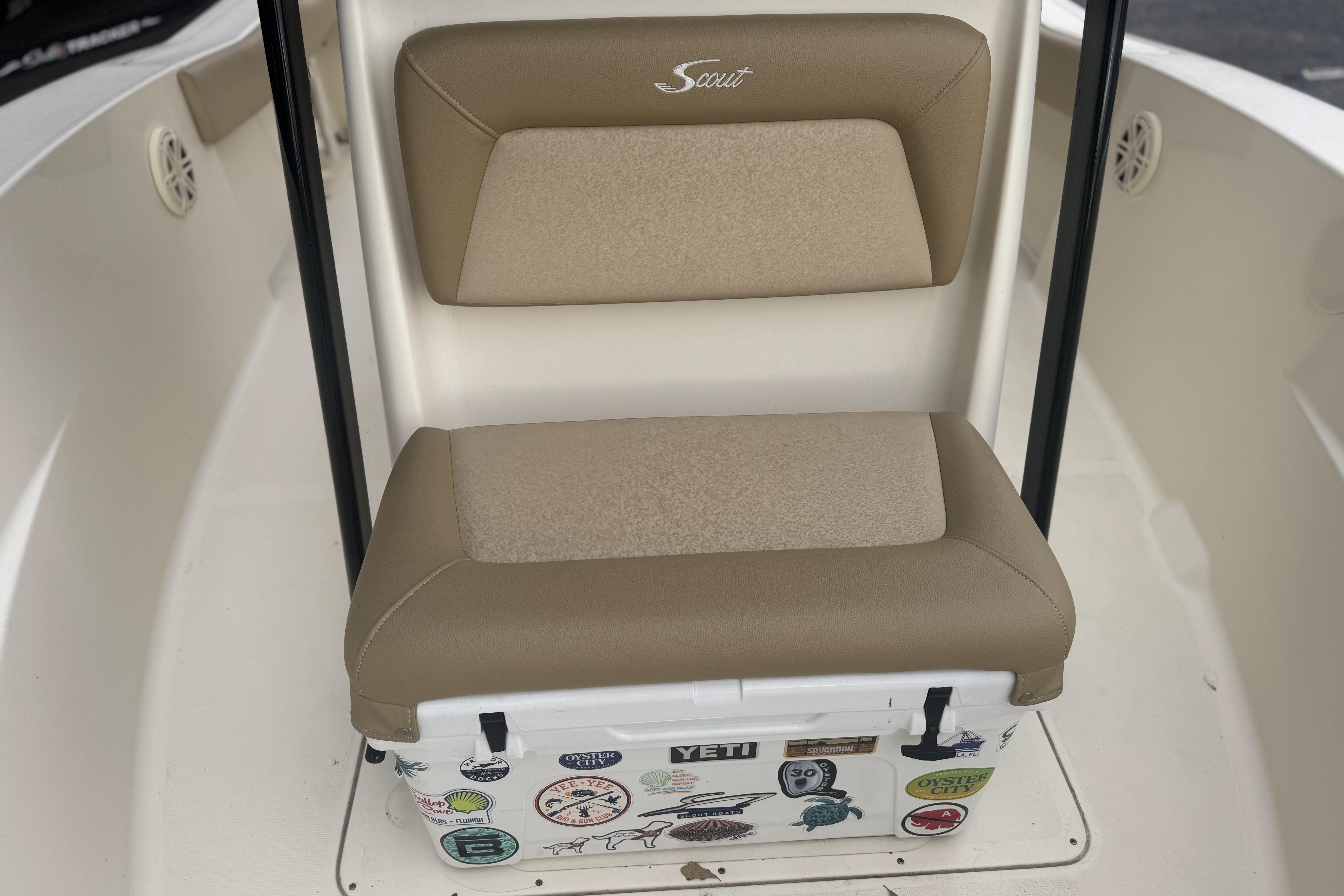 2020 Scout 195 Sportfish boat seat with cooler, featuring various stickers.