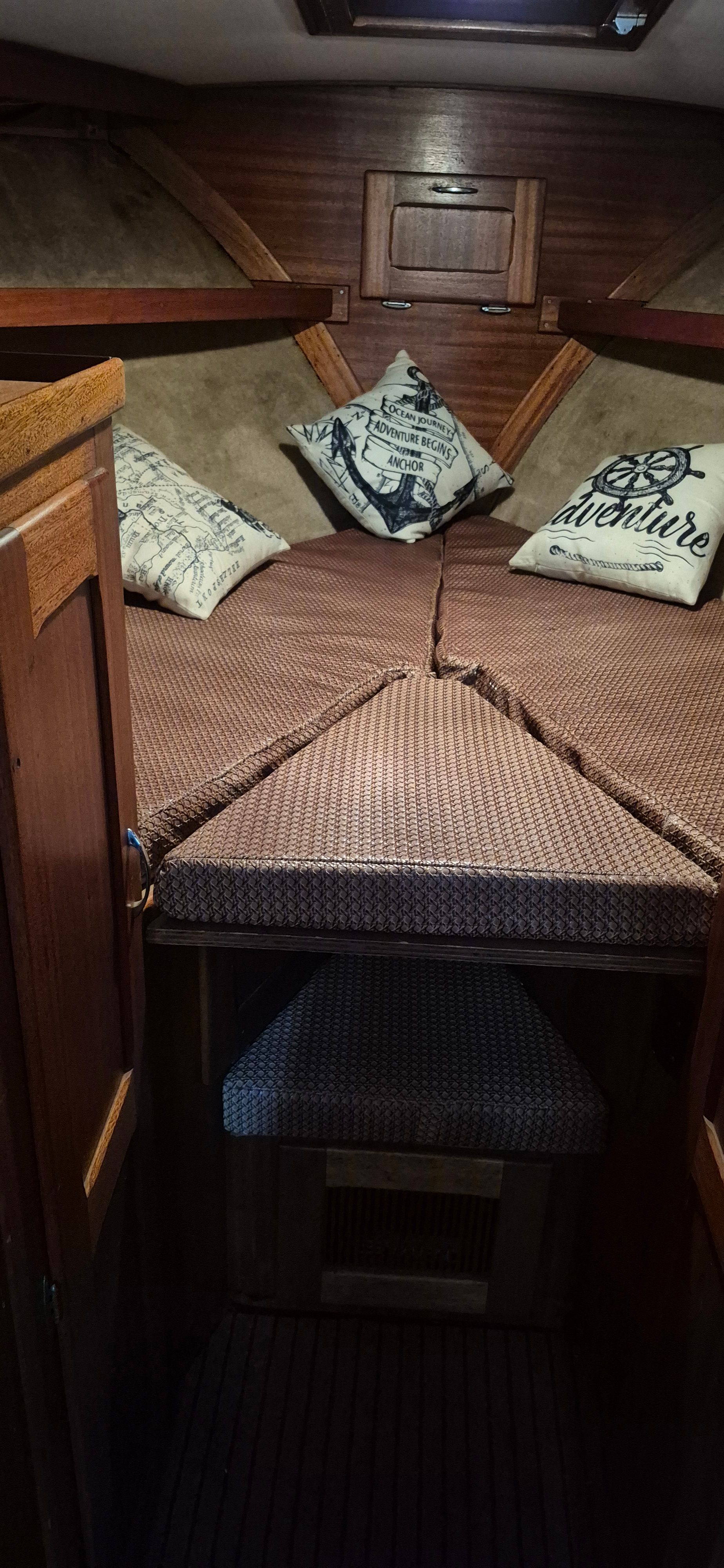 Interior of 1976 Egg Harbor 33 Sportfisher with cozy cushions.