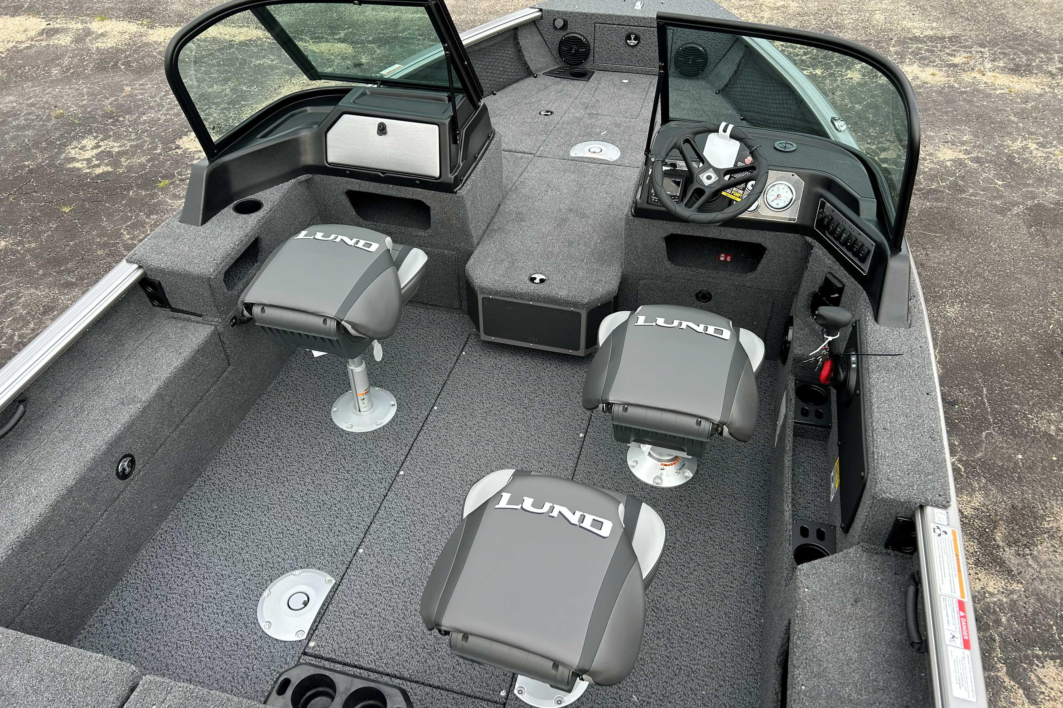 2027 Lund 1775 Impact XS boat interior with seating and steering console.