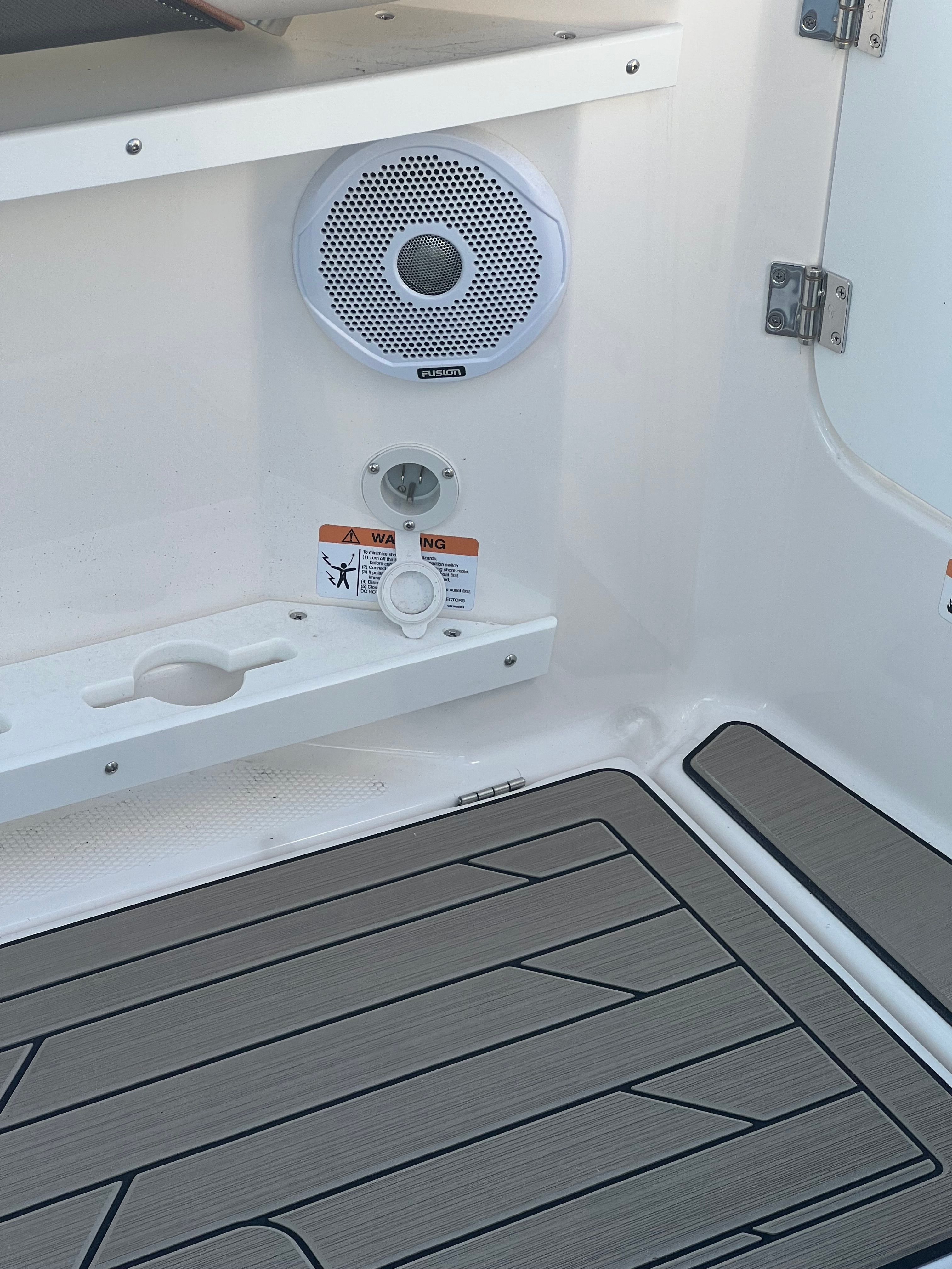 Close-up of cockpit area with speaker and flooring.