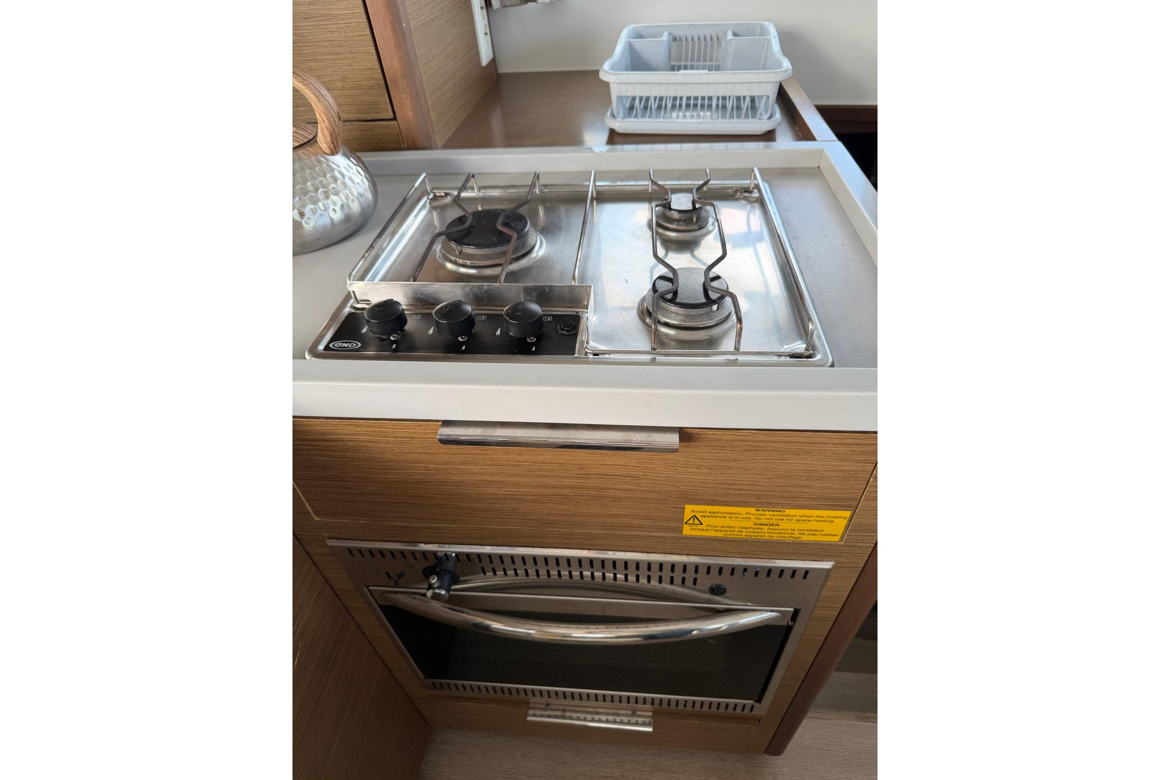 Compact kitchen stove and oven in 2020 Lagoon 40 yacht interior.