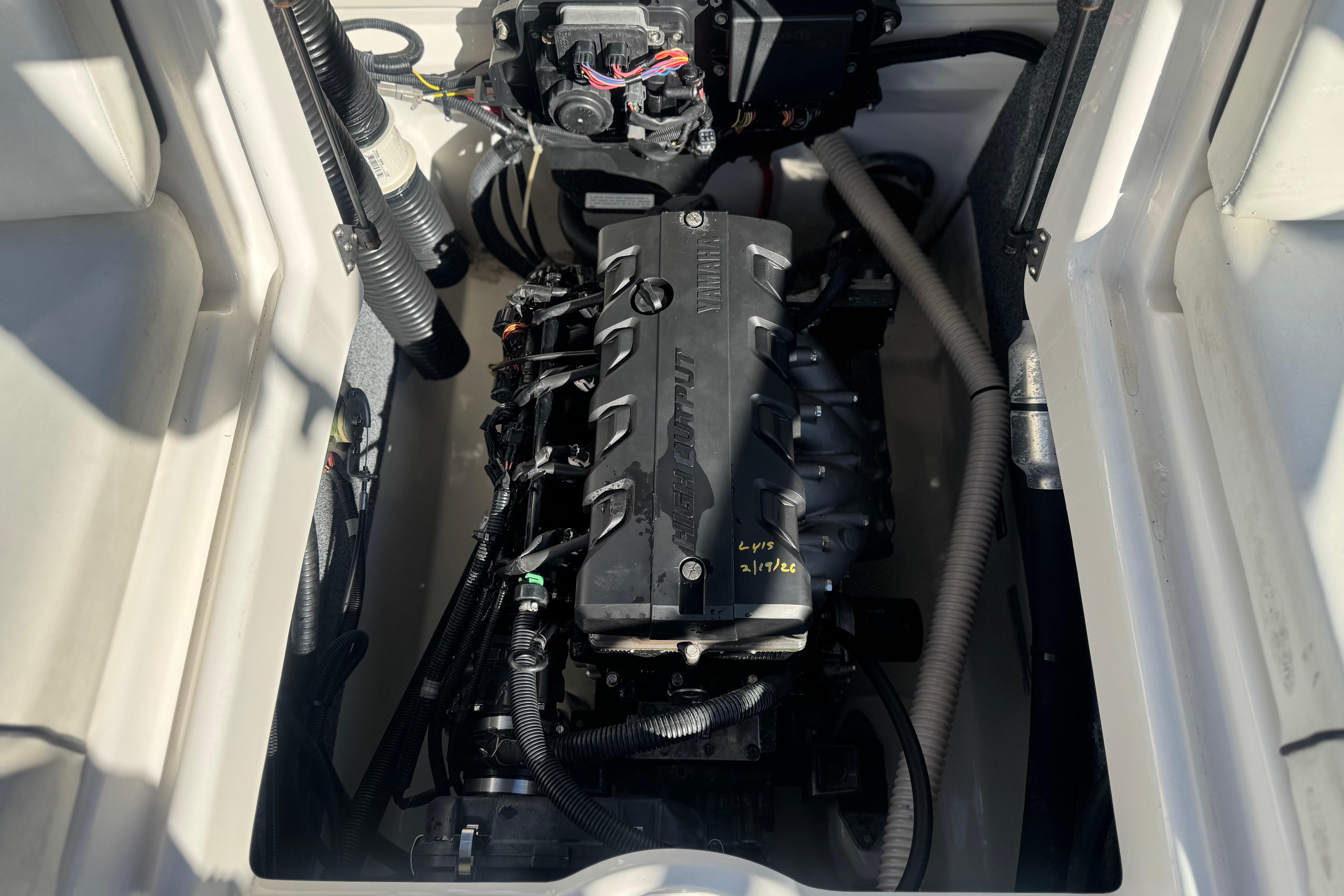 Engine compartment of a 2015 Yamaha Boats AR190, showcasing the high-output engine.