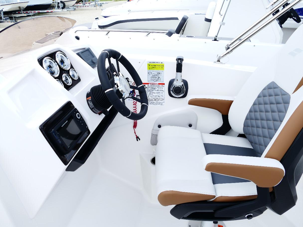 2026 Starcraft SVX 231 OB boat cockpit with modern steering and controls.