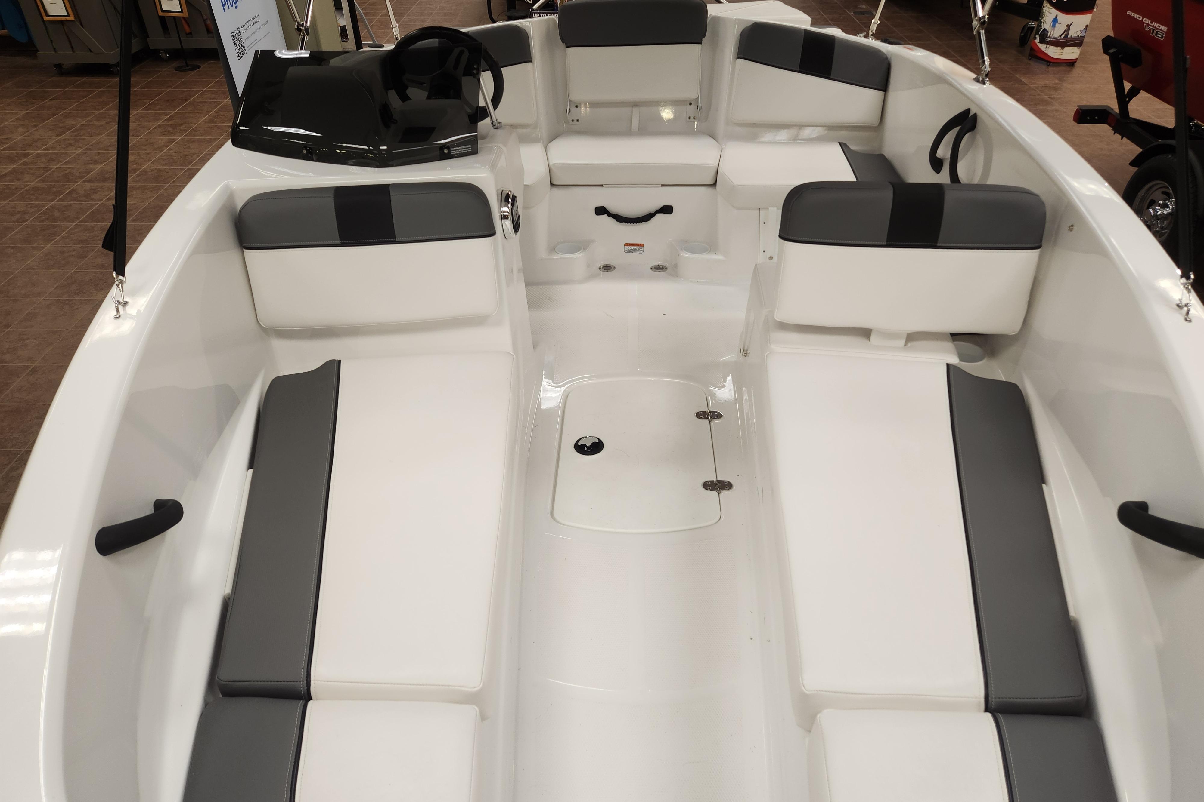2026 Tahoe T16 boat interior with white and gray seating, showcasing spacious design.