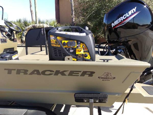 2024 Tracker Grizzly 2072 CC Sportsman boat with Mercury outboard motor.