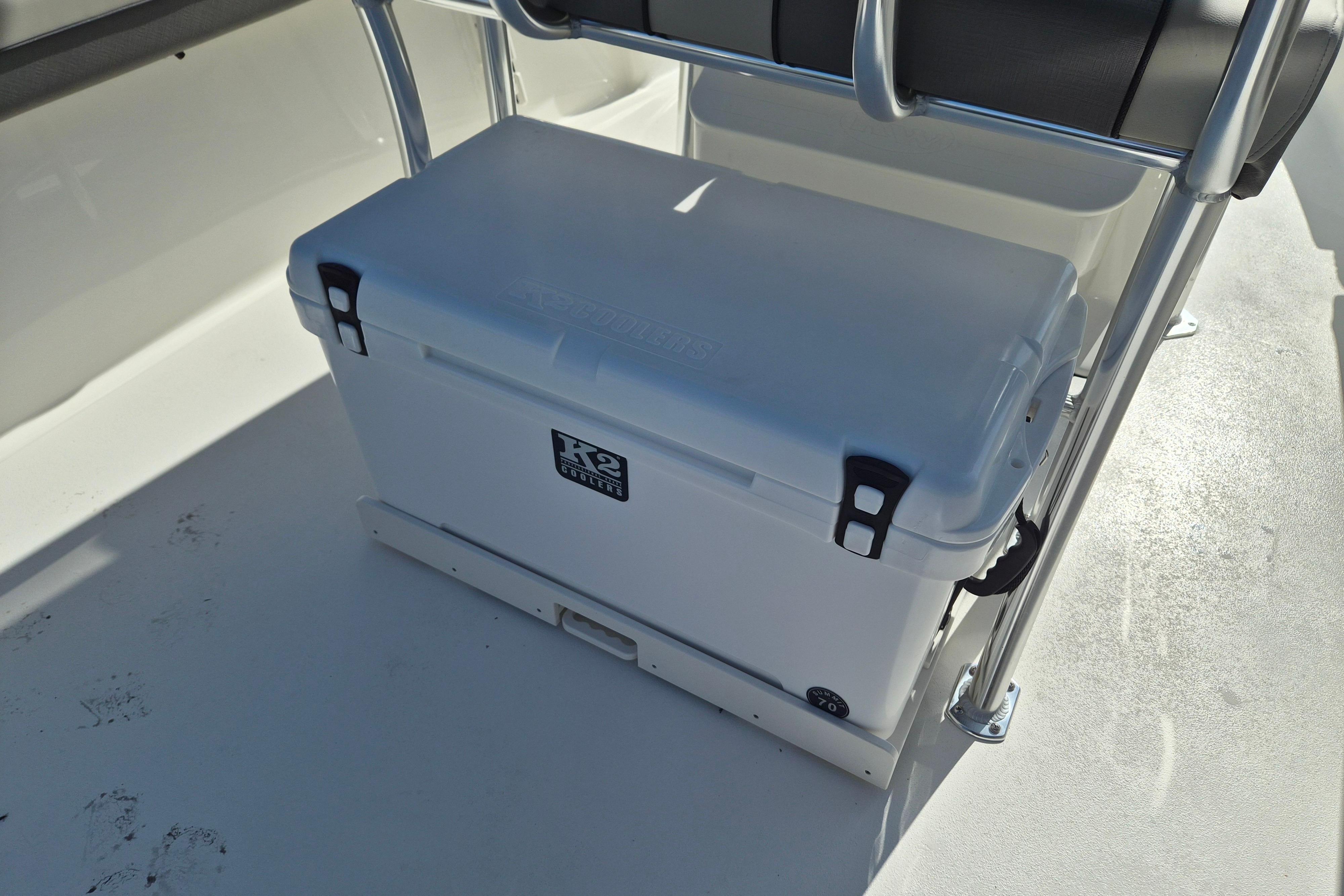 White cooler on 2026 Key West 239 FS boat deck, secured with metal frame.