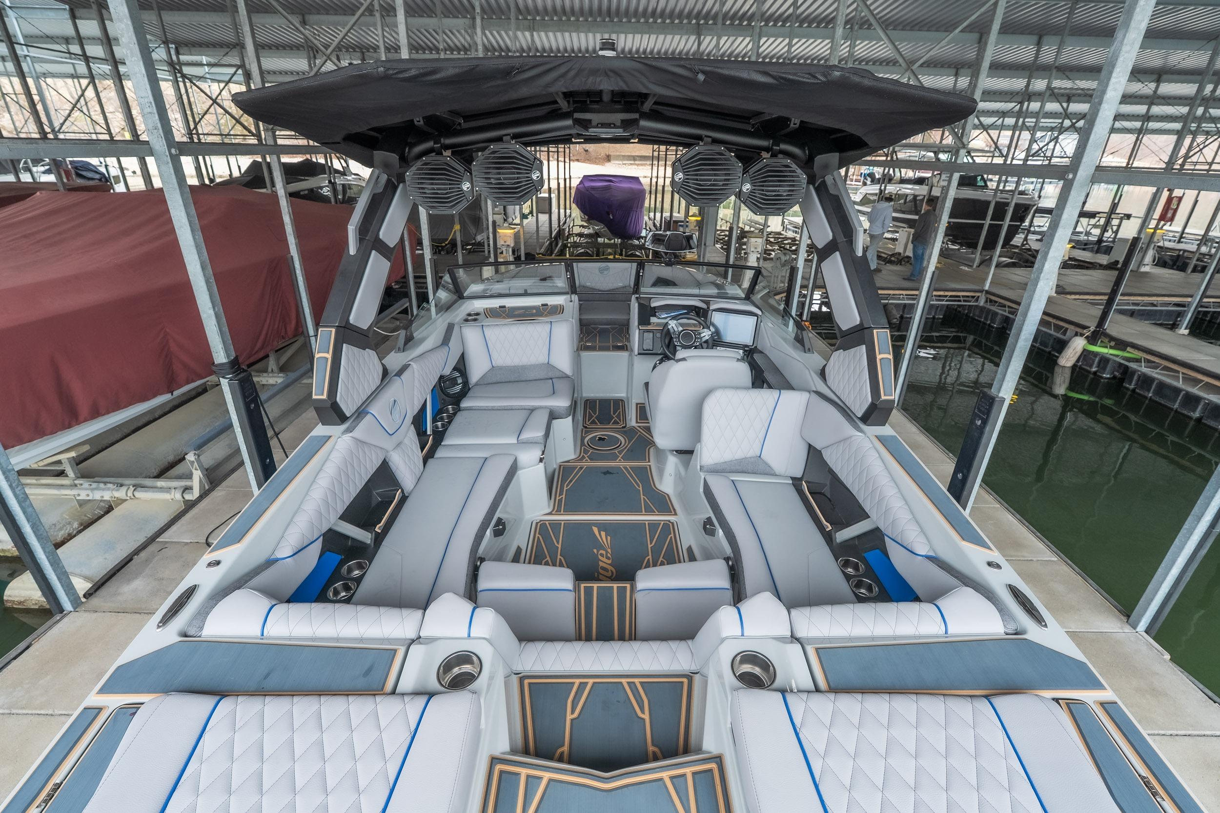 2026 Tigé Z3 boat interior with luxurious seating and modern design in a covered dock.