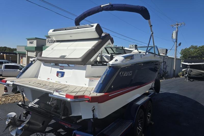 2022 Cobalt R4 boat on trailer, rear view, sunny day, outdoor setting.