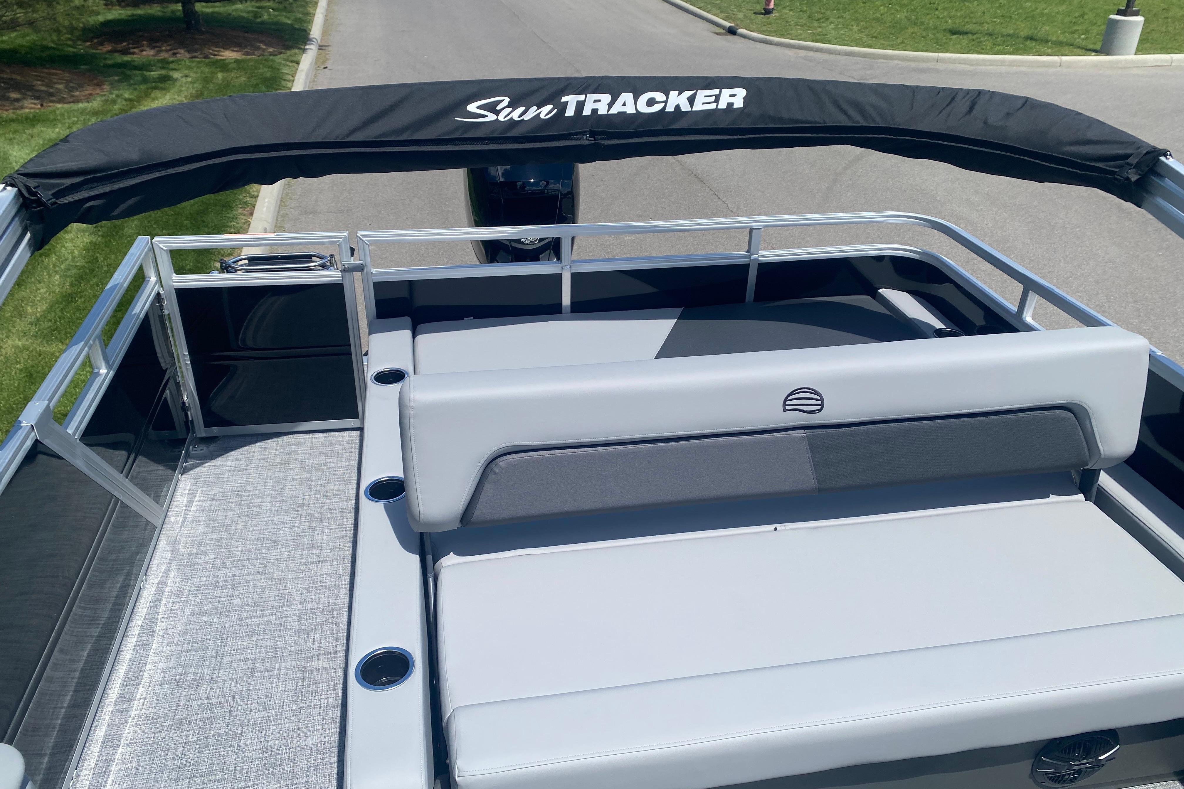 2026 Sun Tracker Party Barge 22 RF DLX pontoon boat with sleek seating and canopy.