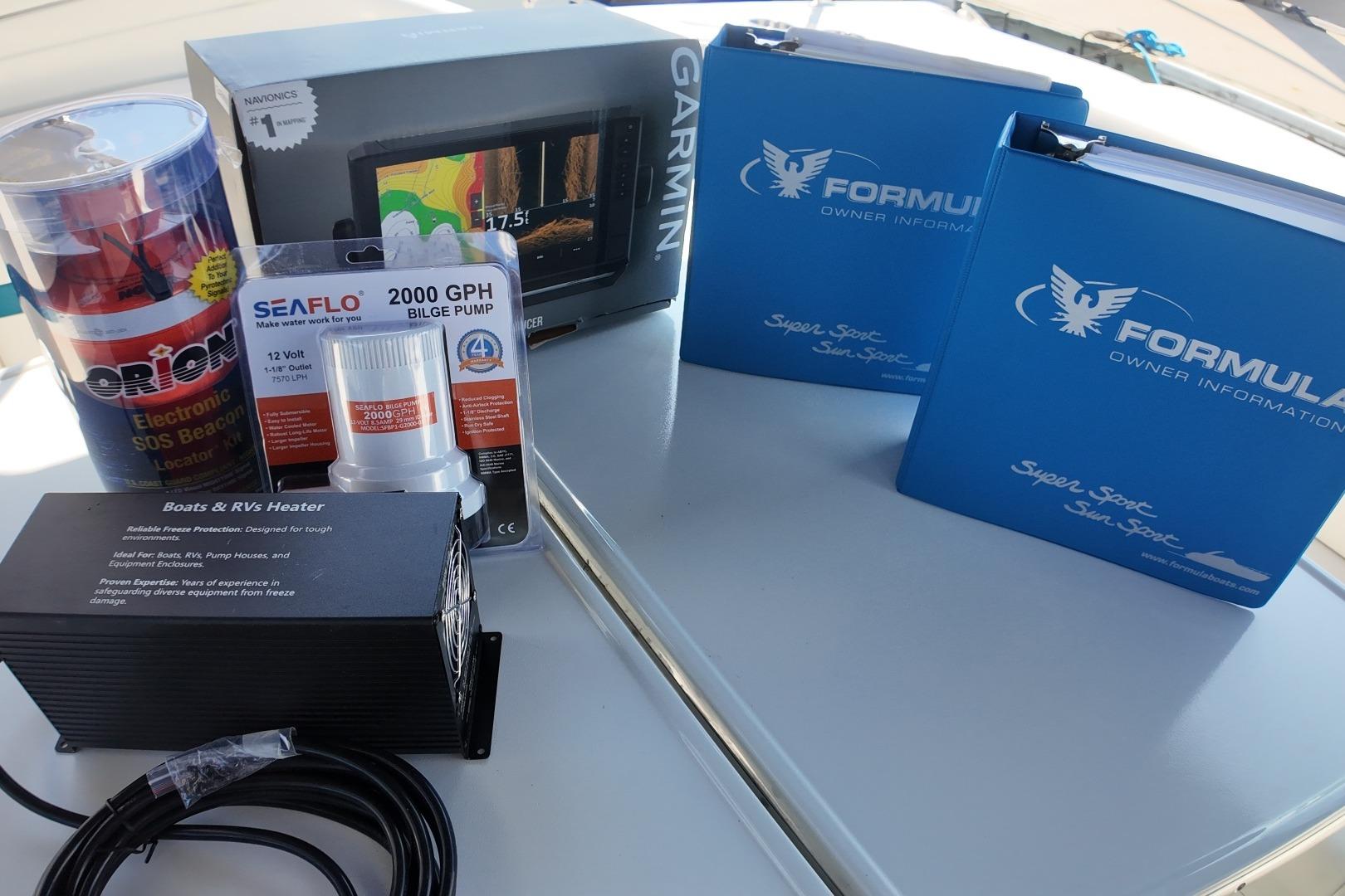 Boating equipment and manuals for 2007 Formula 330 Sun Sport, including Garmin GPS and SEAFLO bilge pump.