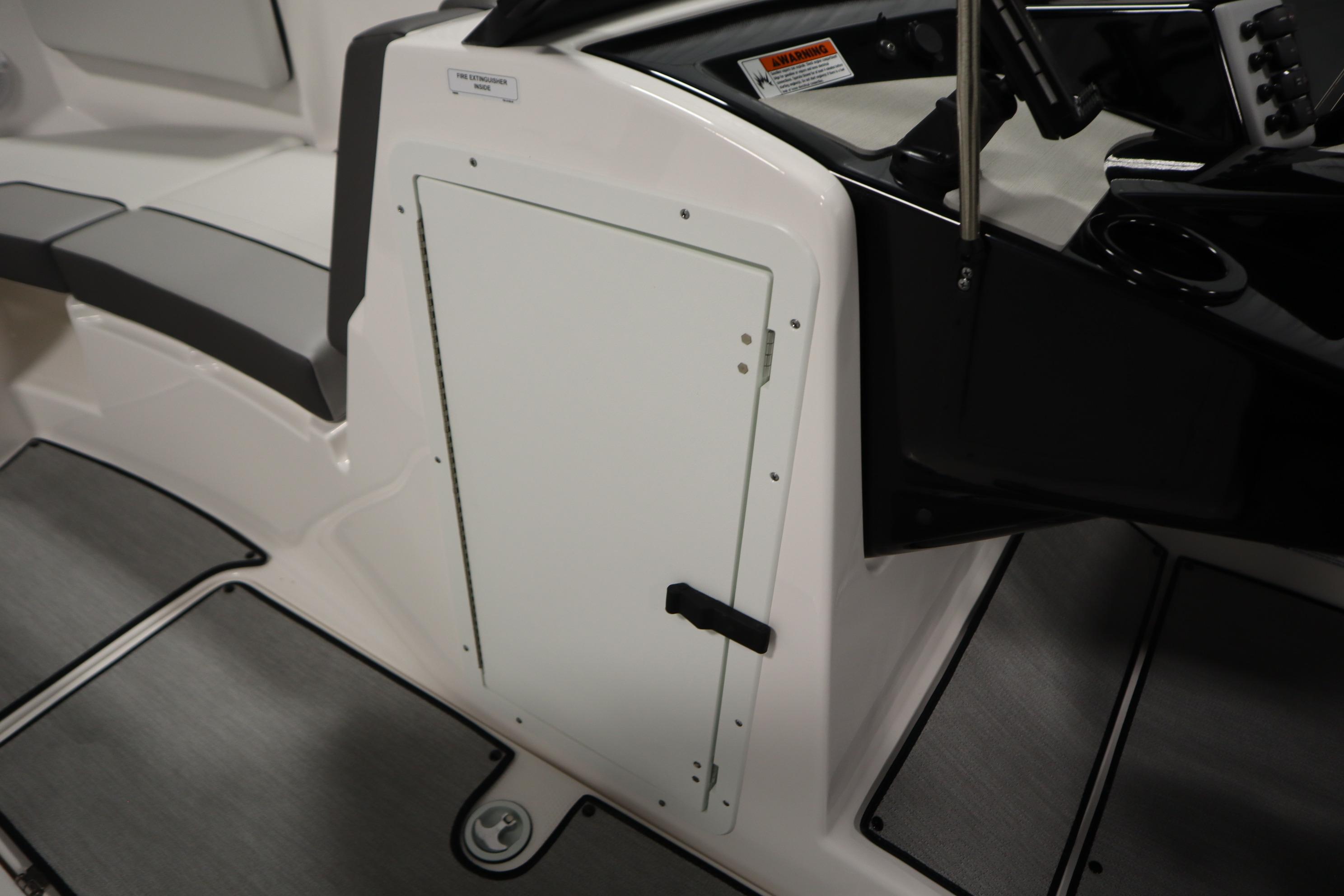 2026 Yamaha Boats AR220 interior, featuring sleek seating and storage compartment.