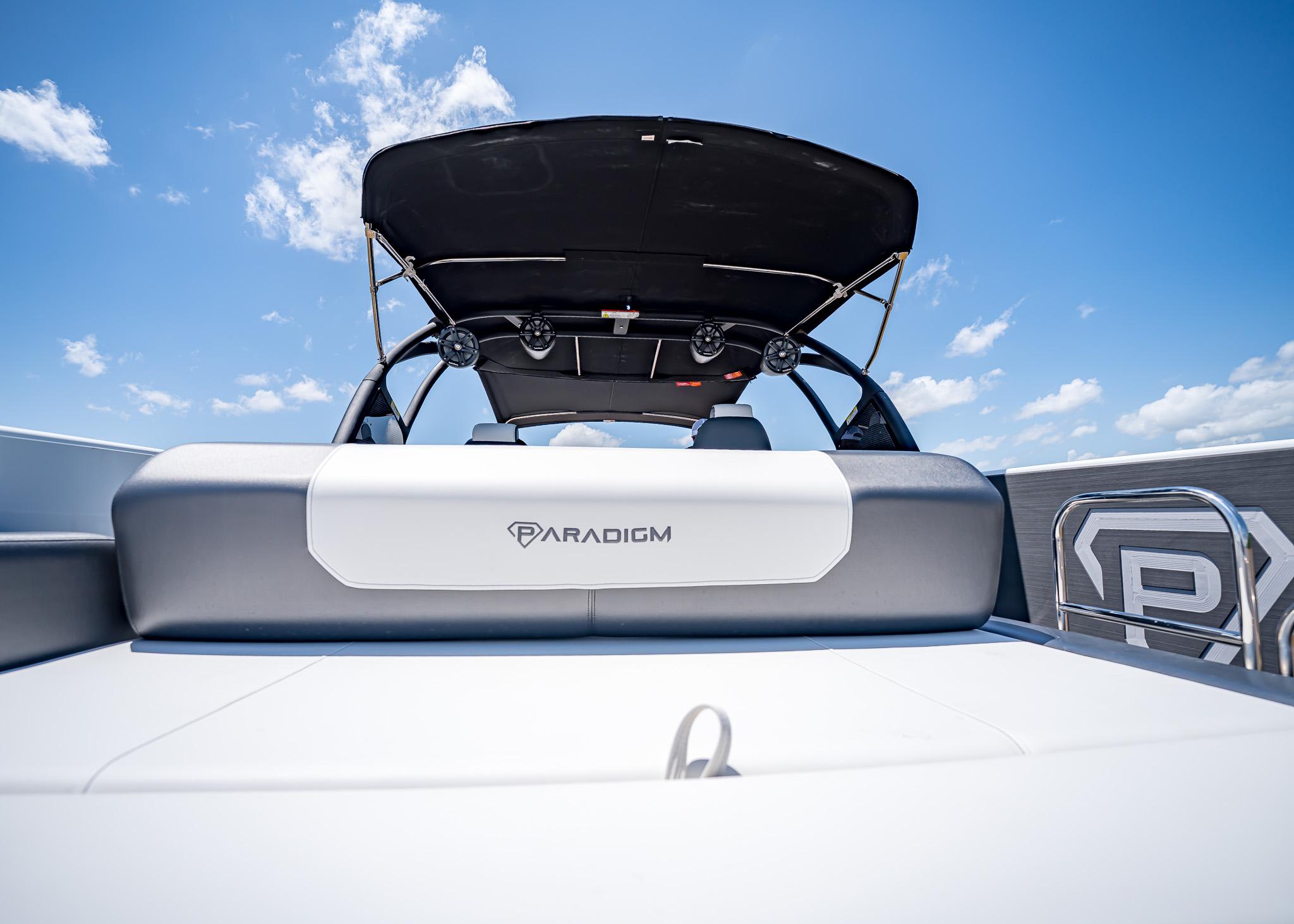 2025 Paradigm Damascus 266 Surf boat with sleek design under clear blue sky.