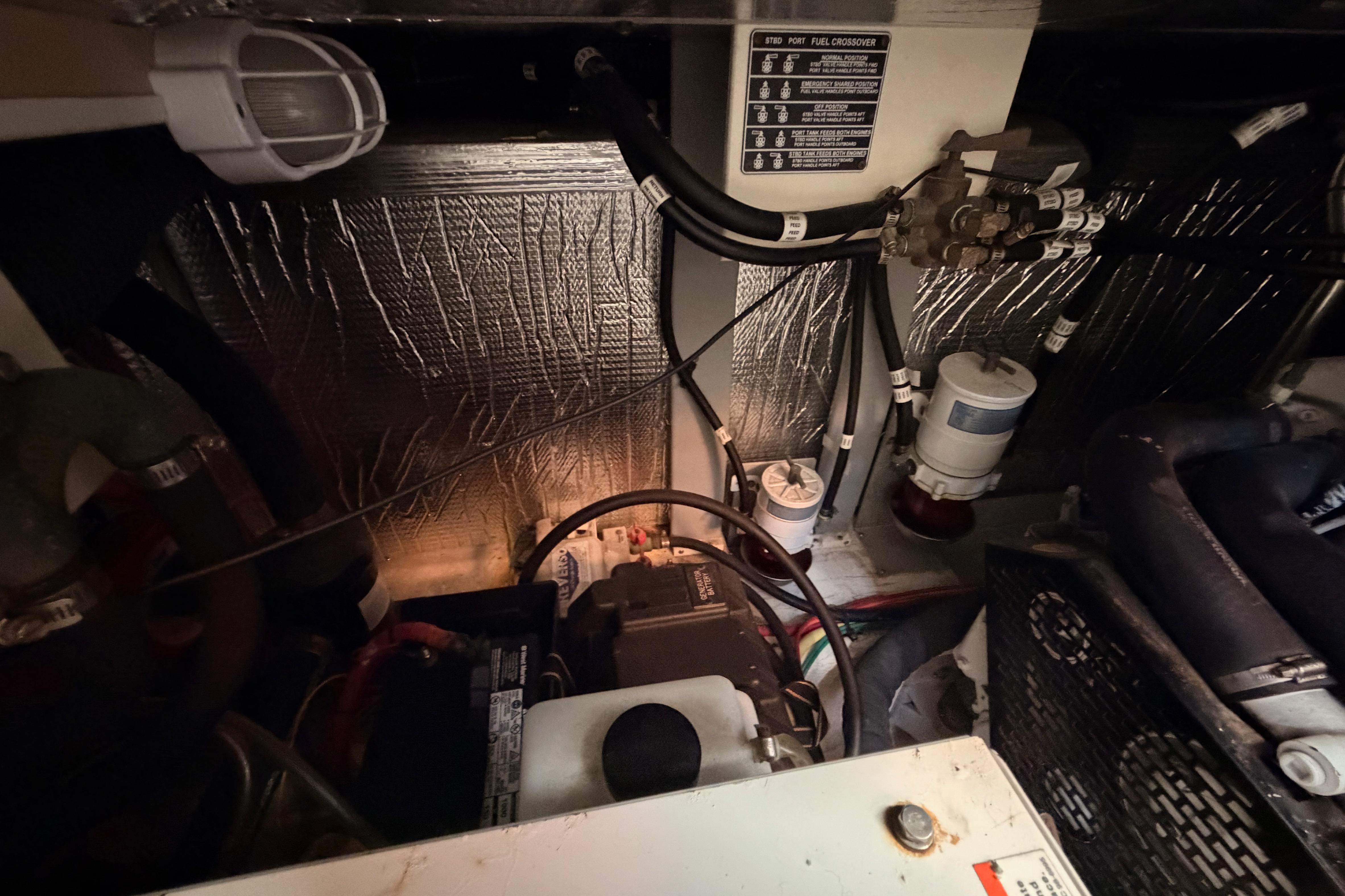 Engine room of 2005 Cruisers Yachts 405 Express Motoryacht with wiring and components.