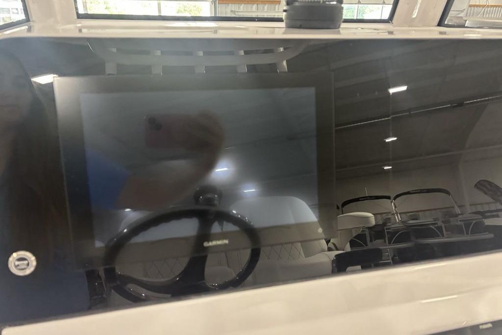 2026 Sportsman Open 252 Center Console dashboard with Garmin display in a showroom.