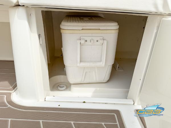 Storage compartment with cooler on a 2008 Sea Ray 270 SLX boat.