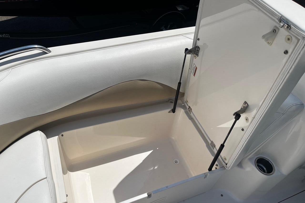 Open storage compartment on a 2008 Hurricane FD202 boat, showcasing interior space.