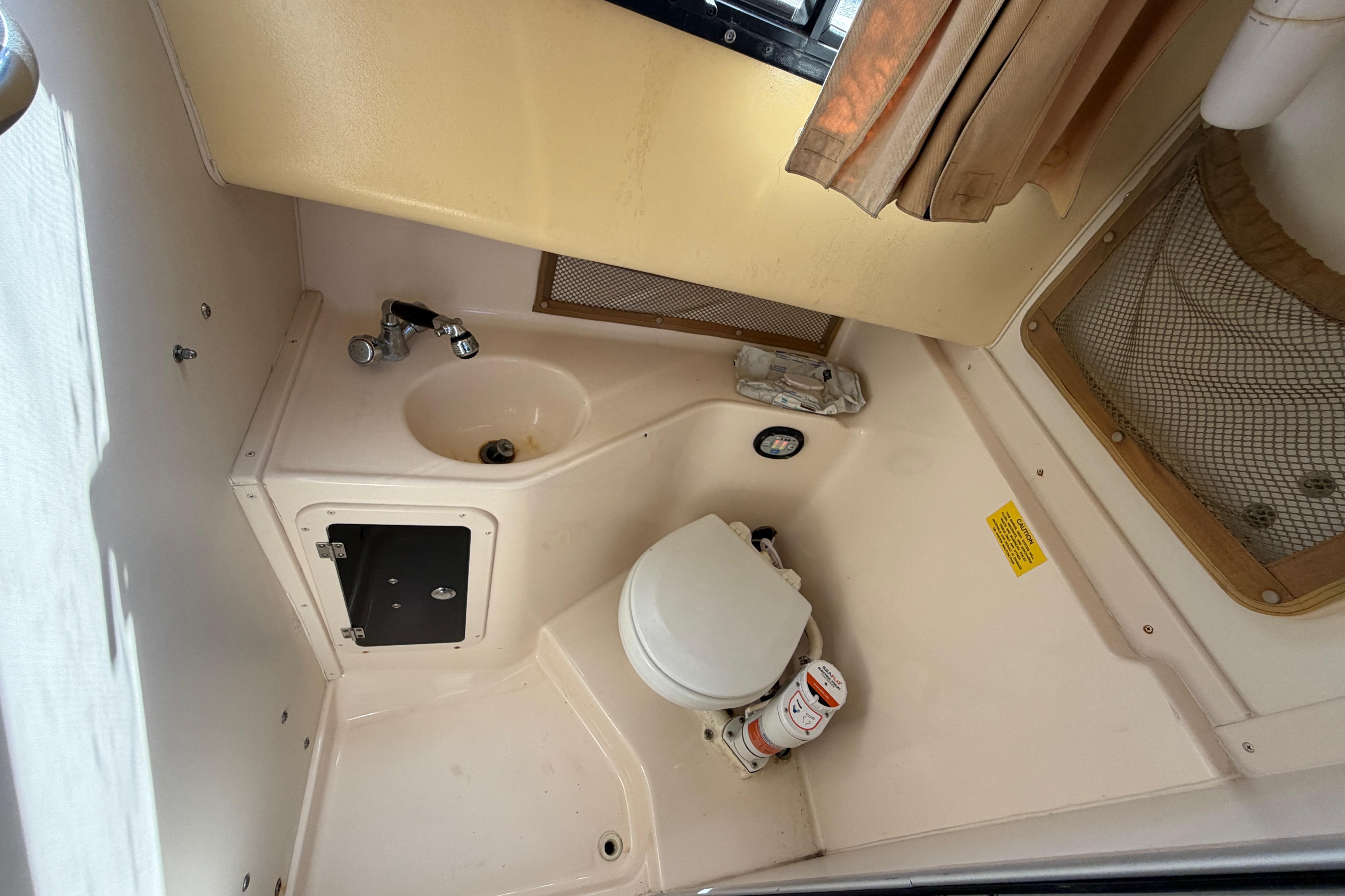 2006 Grady-White Sailfish 282 boat interior with compact bathroom amenities.