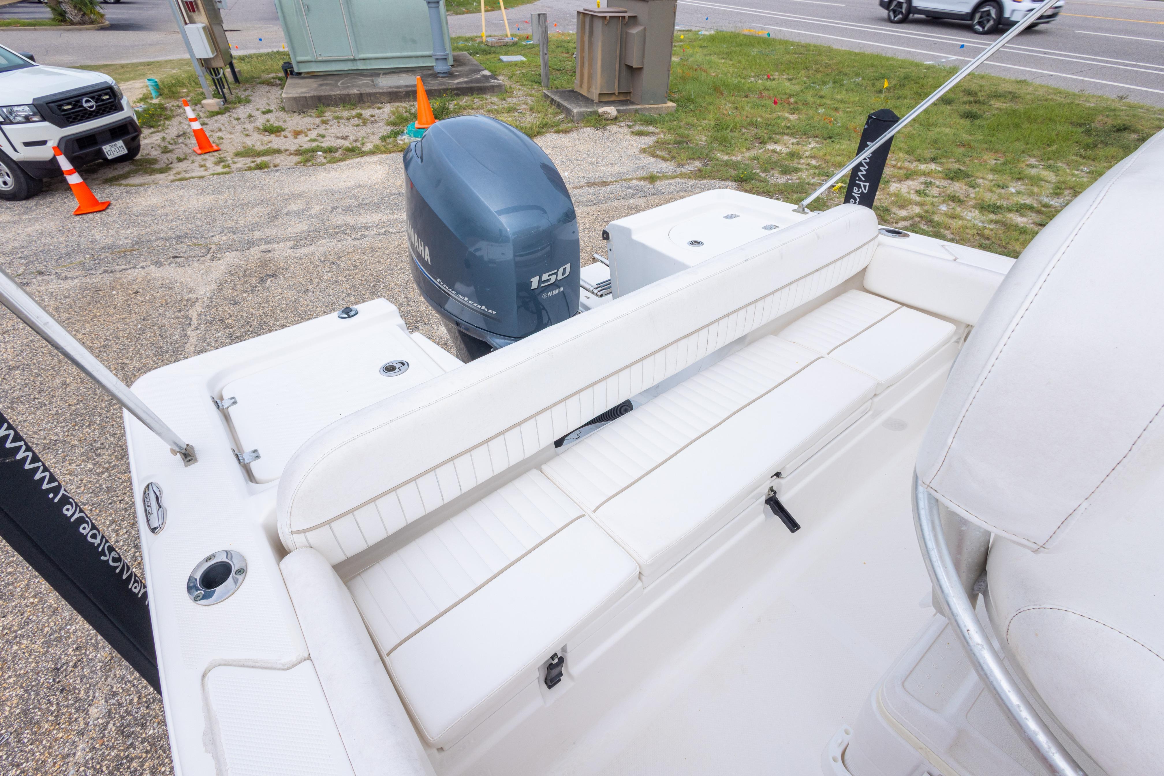 2014 Sea Fox 209 Commander boat with Yamaha 150 engine, featuring white seating and deck.