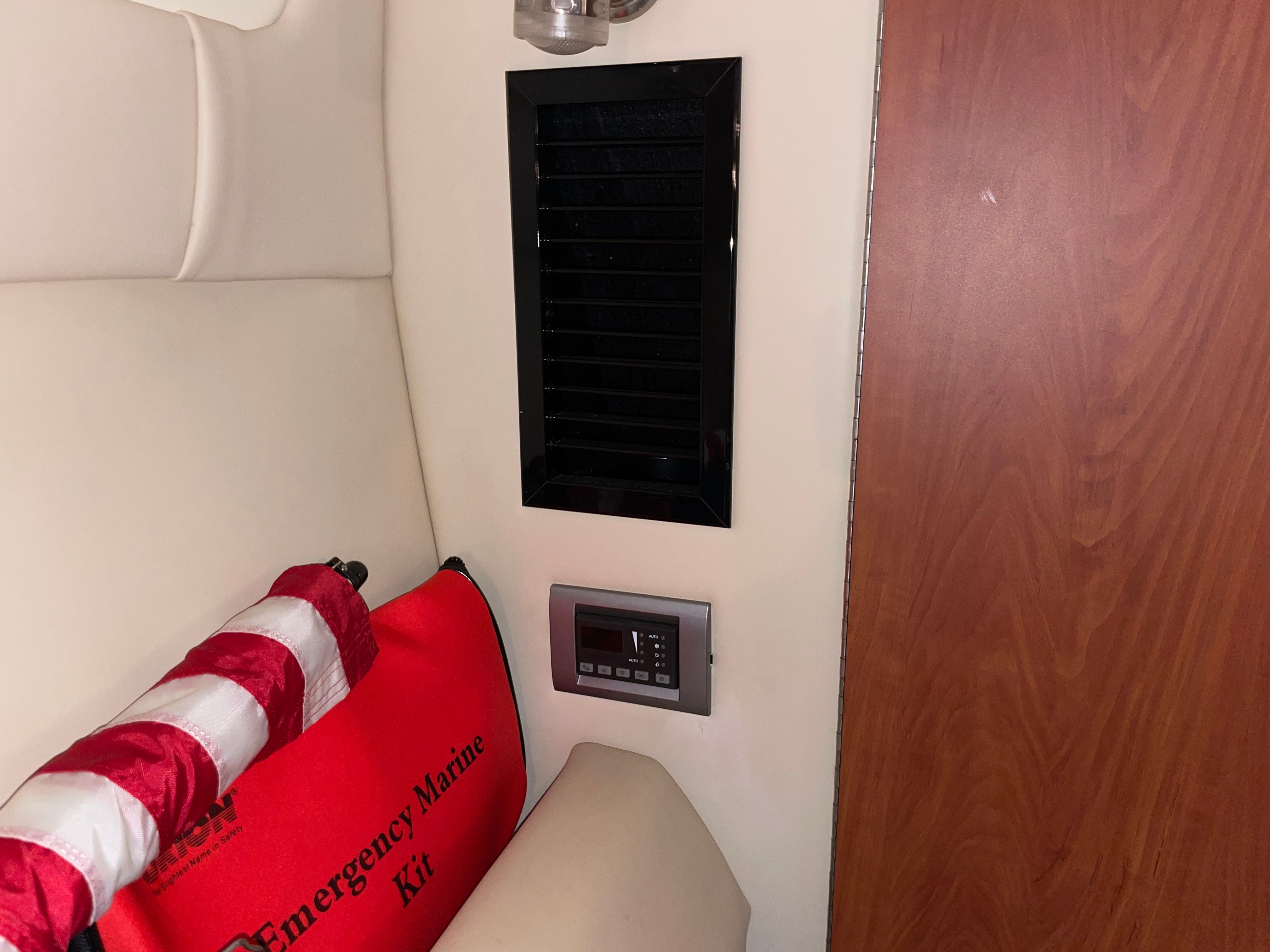 Interior of a Monterey 280 Sport Cruiser with emergency kit.