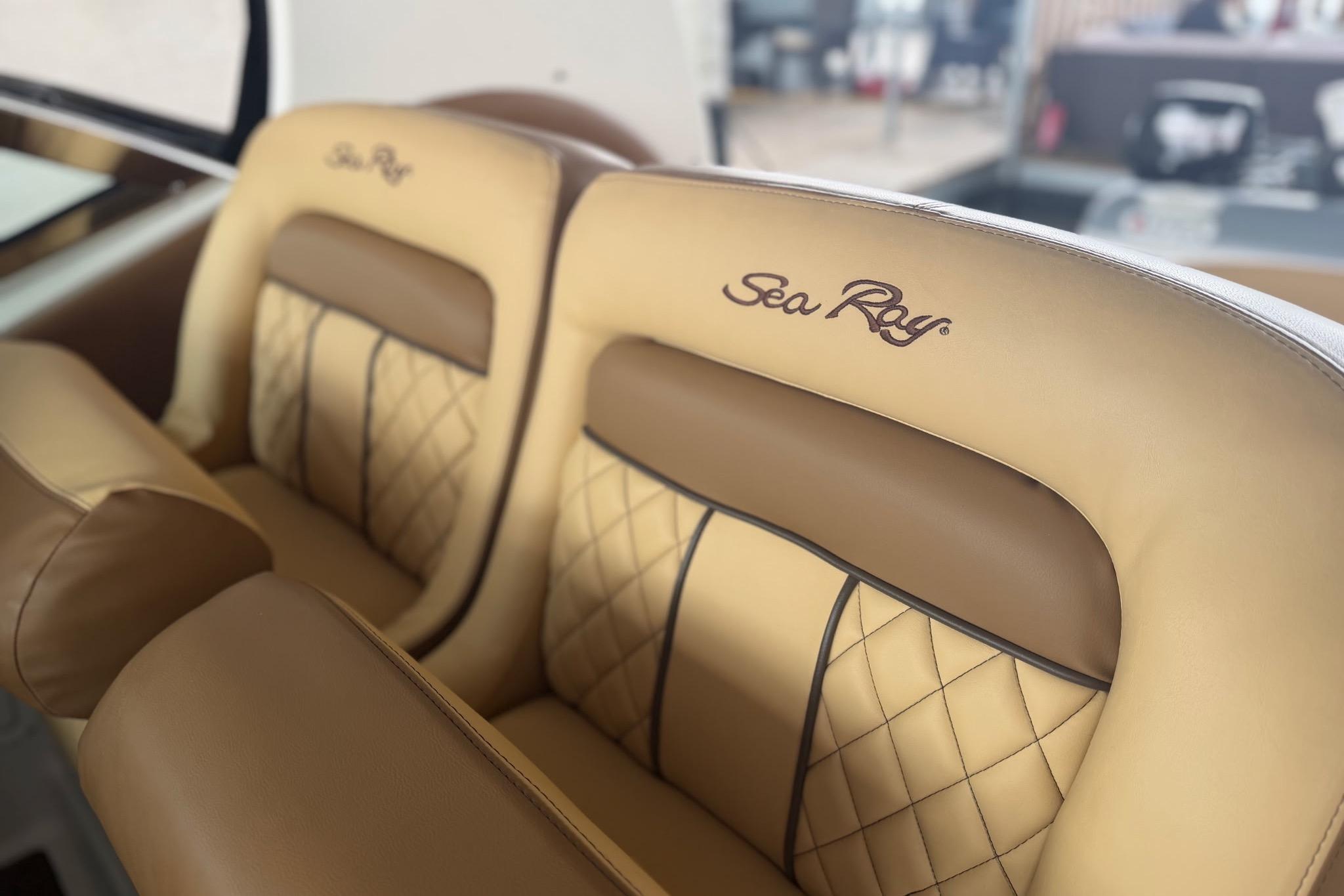 Luxurious leather seats on a 2002 Sea Ray Sundancer 320 boat interior.