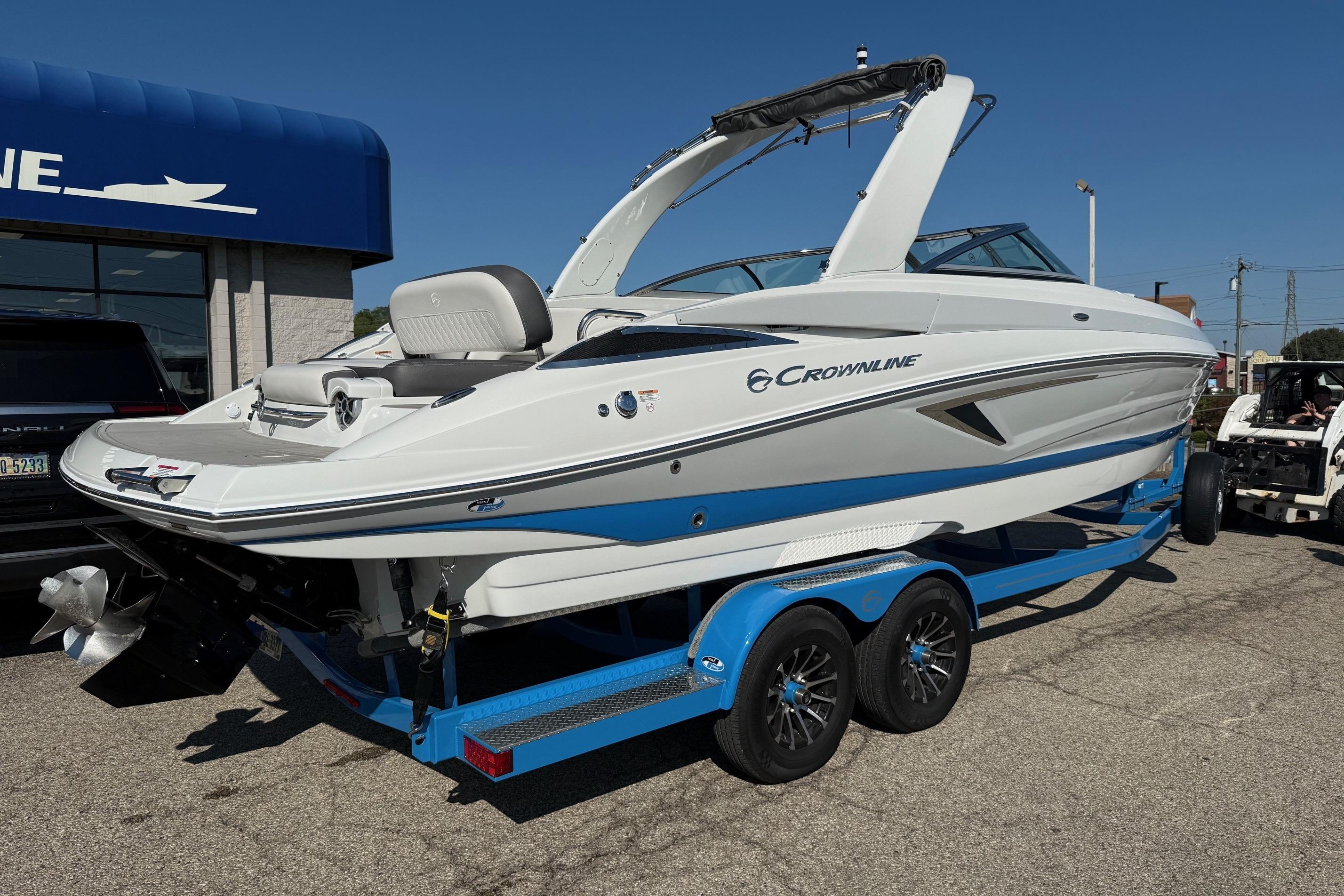 2023 Crownline 290 SS boat on trailer, displayed outdoors at dealership.