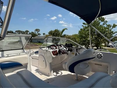 Interior of a 2011 Tahoe 216 WT boat with blue canopy.