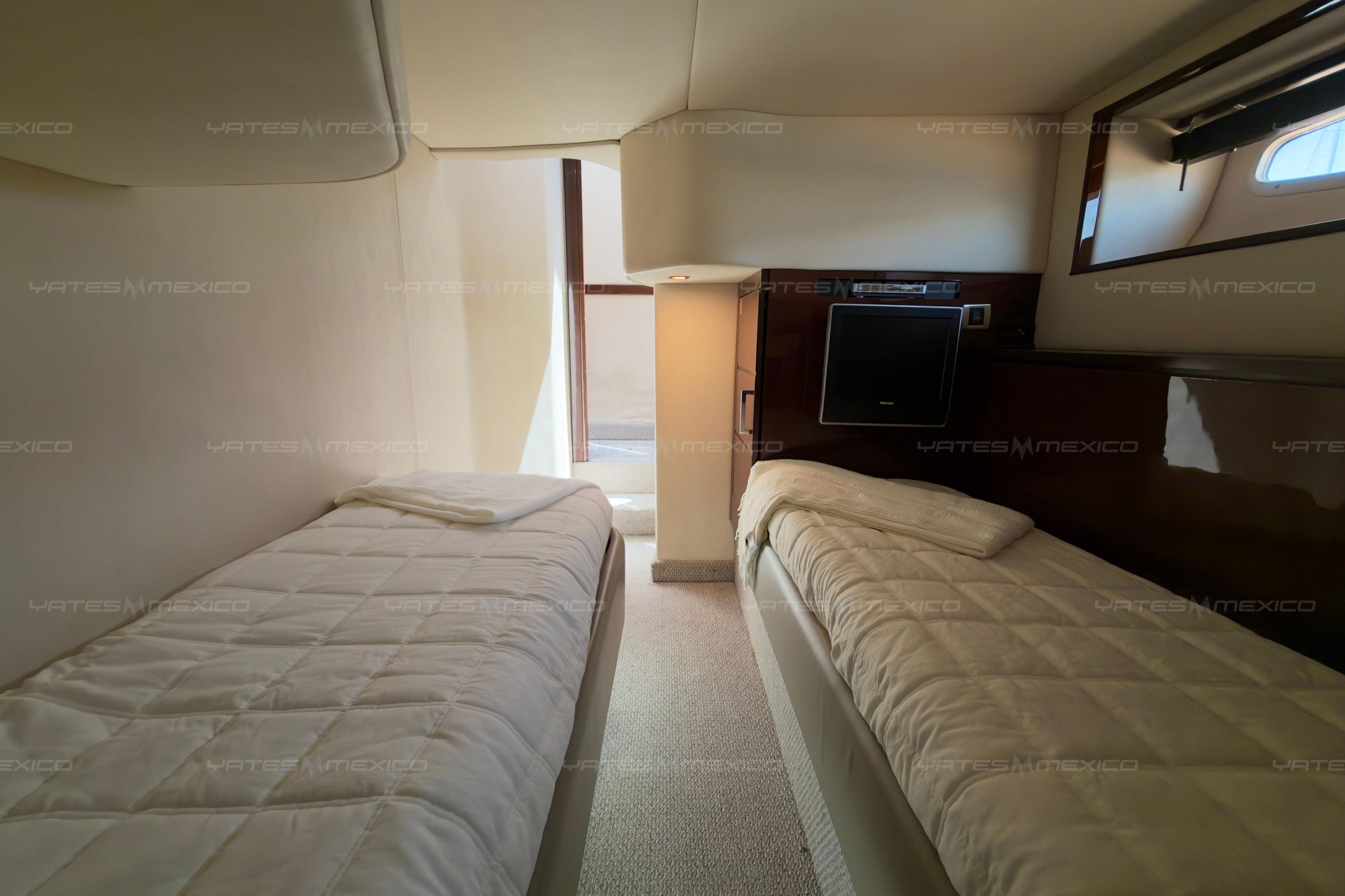 Interior cabin of 2008 Sea Ray 480 Sedan Bridge with twin beds.