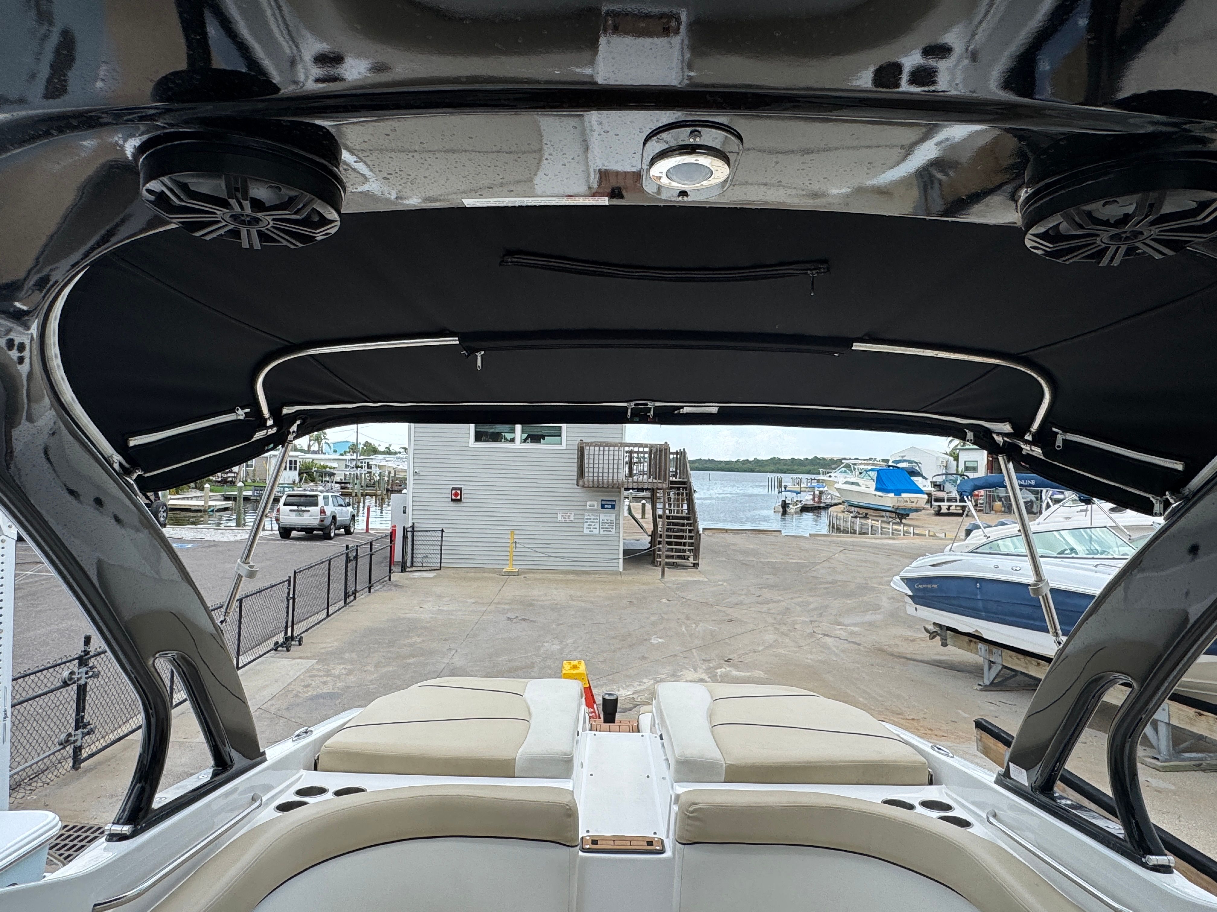 Interior view of a 2017 Rinker QX29 BR boat at the dock.