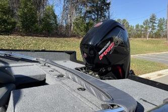 2026 Tracker Pro Guide V-175 Combo boat with powerful outboard motor in a scenic outdoor setting.