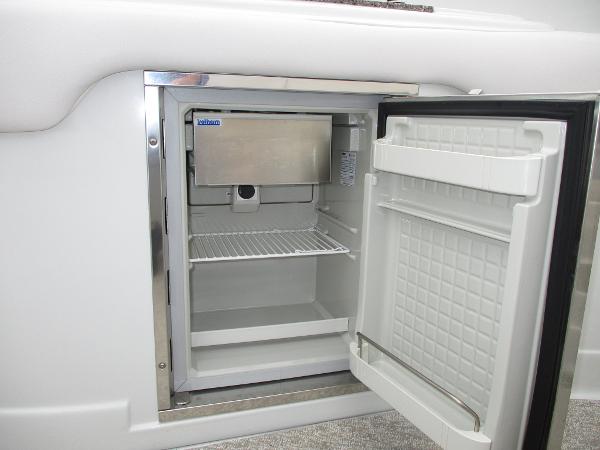 Open refrigerator in a 2015 Crownline 285 SS yacht.