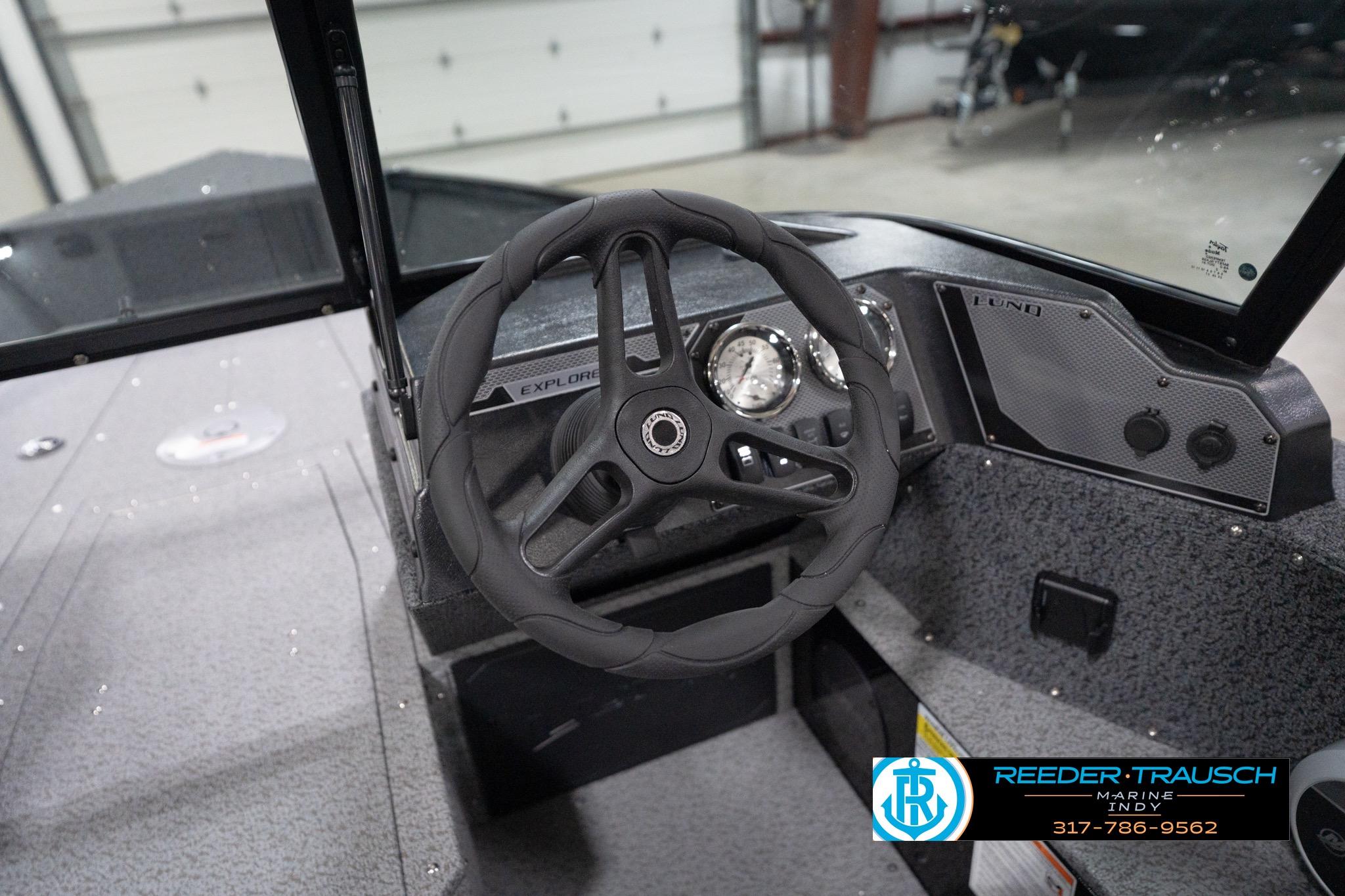 2026 Lund 1800 Explorer Sport boat dashboard with steering wheel and gauges.