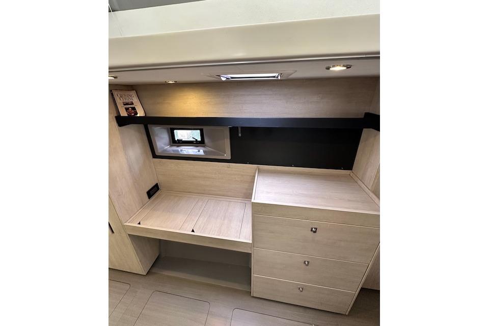 Interior of 2017 Leopard 40 yacht with modern wood finish and storage drawers.