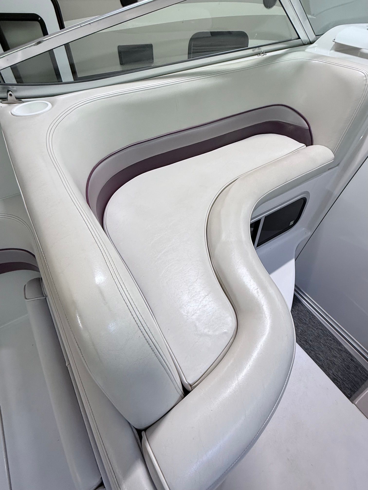 The 1997 Chaparral Signature 260 interior features white upholstery with purple accents.