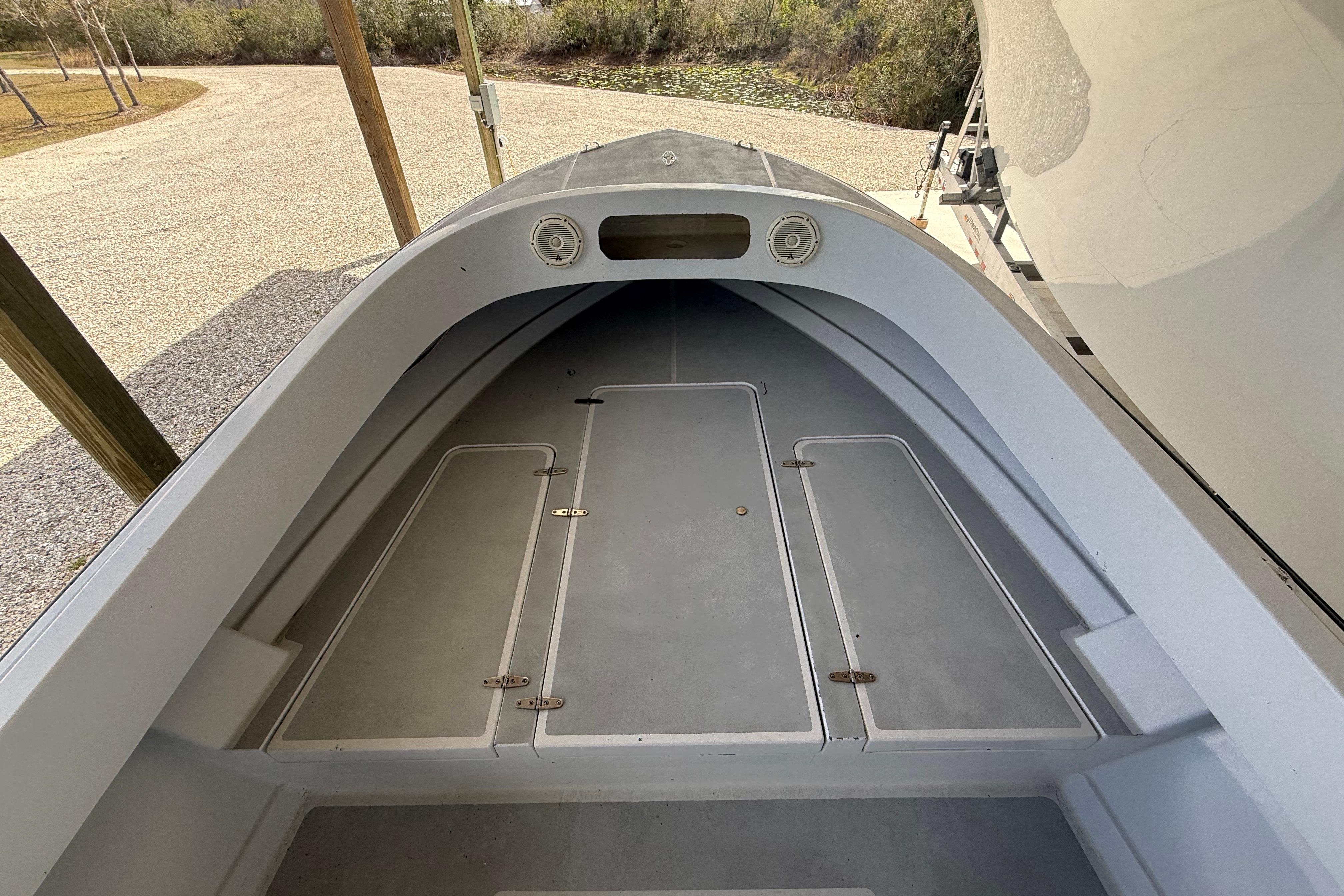 1974 Aquasport 2400 Center Console boat interior with storage compartments.