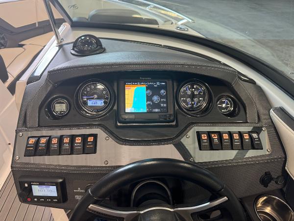 Dashboard of a 2018 Monterey 258 Super Sport boat with navigation and control panels.
