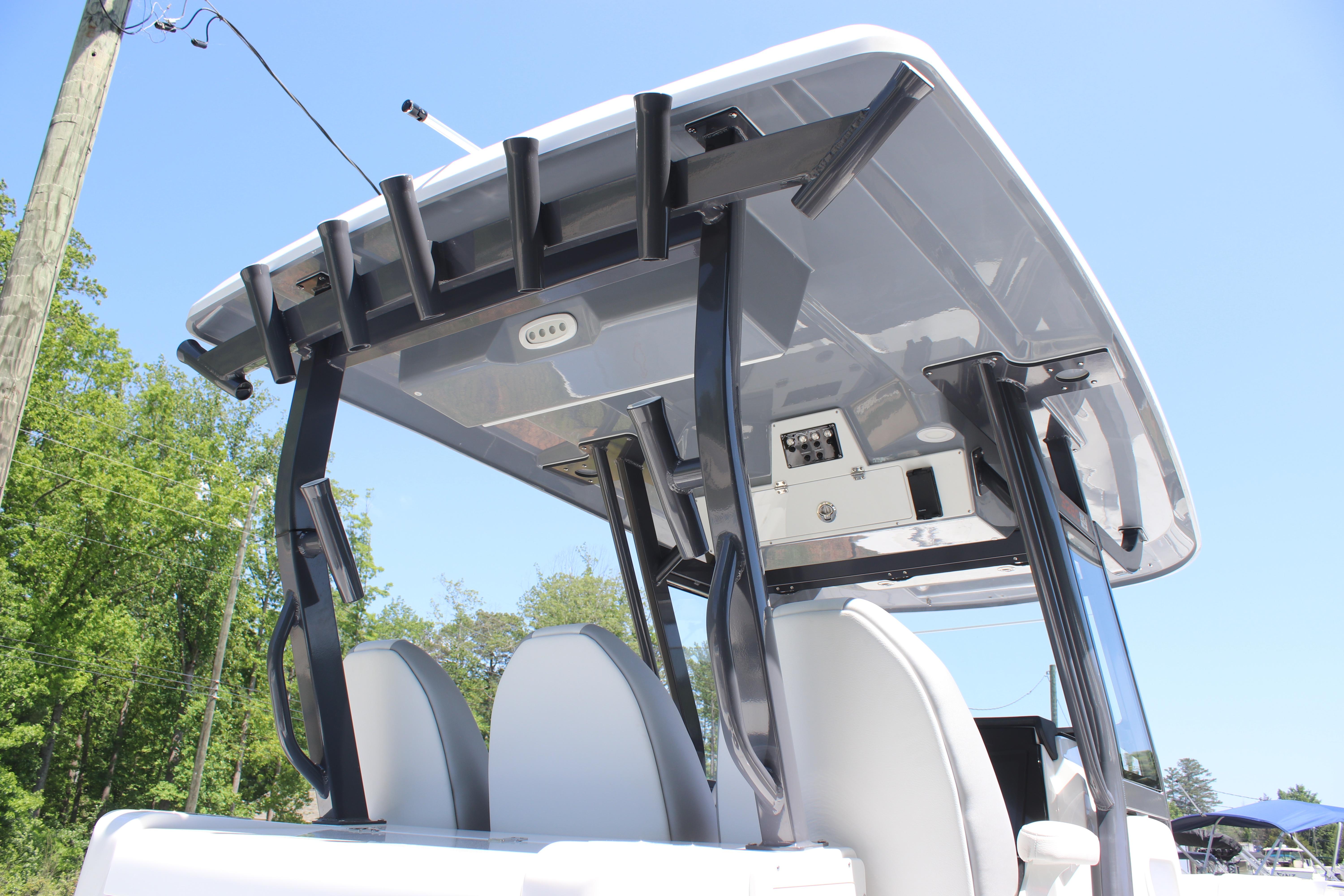 2025 Sea Fox 328 Commander boat with T-top and rod holders, viewed from below.